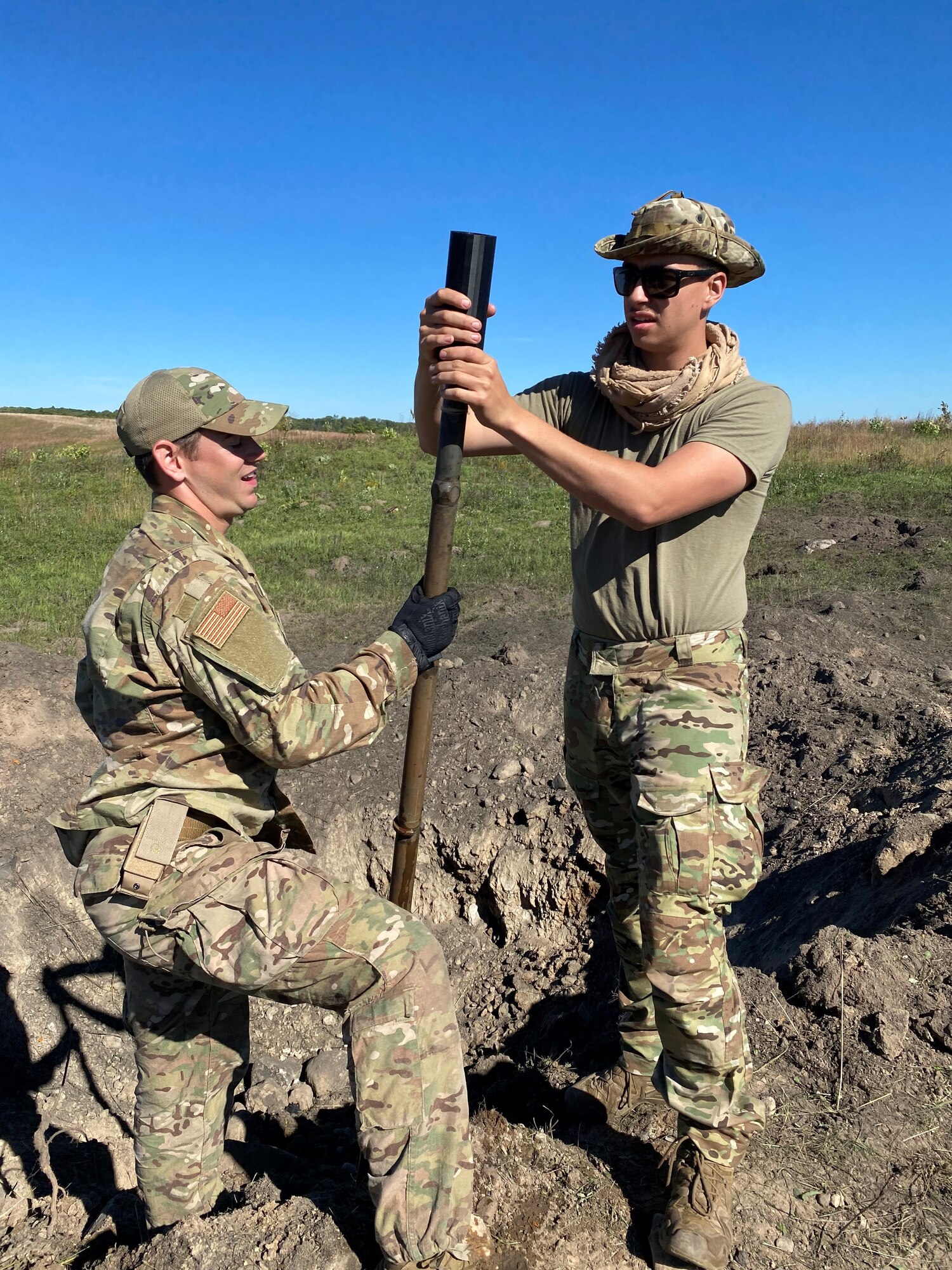 Air National Guard Explosive Ordnance technicians place a 3-D printed adapter on a 30mm barrel during lodged projectile training at the Advanced EOD conventional course, Camp Ripley, Minnesota Sept. 20-24, 2021.  (U.S. Air National Guard photo by Master Sgt. Mark Hilleren)
