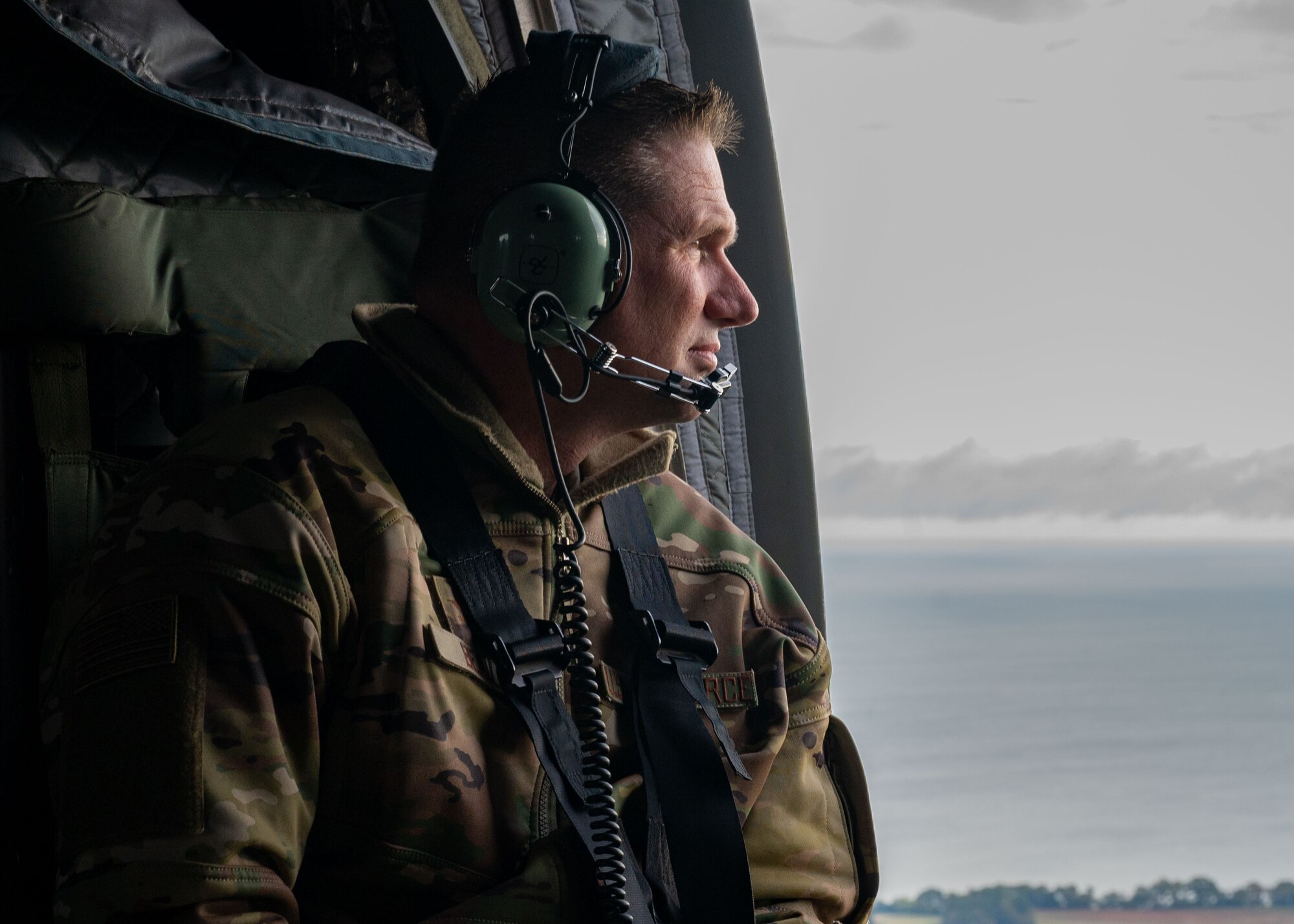 Col Beaulieu looks out the window of a CH-47 Chinook rotary aircraft