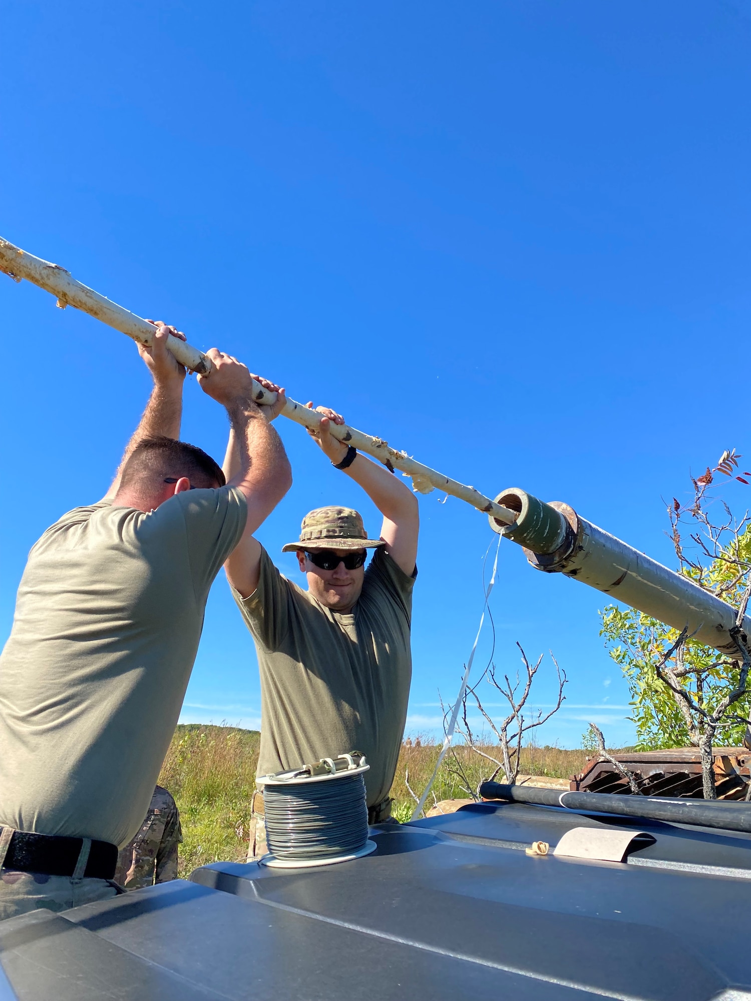 Air National Guard Explosive Ordnance technicians improvised a ram rod to place an expelling charge during lodged projectile training at the Advanced EOD conventional course, Camp Ripley, Minnesota, September 20-24, 2021.  (U.S. Air National Guard photo by Master Sgt. Mark Hilleren)
