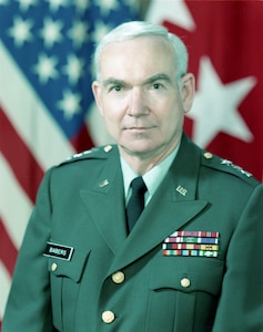 Male Army Lieutenant General with flags in background