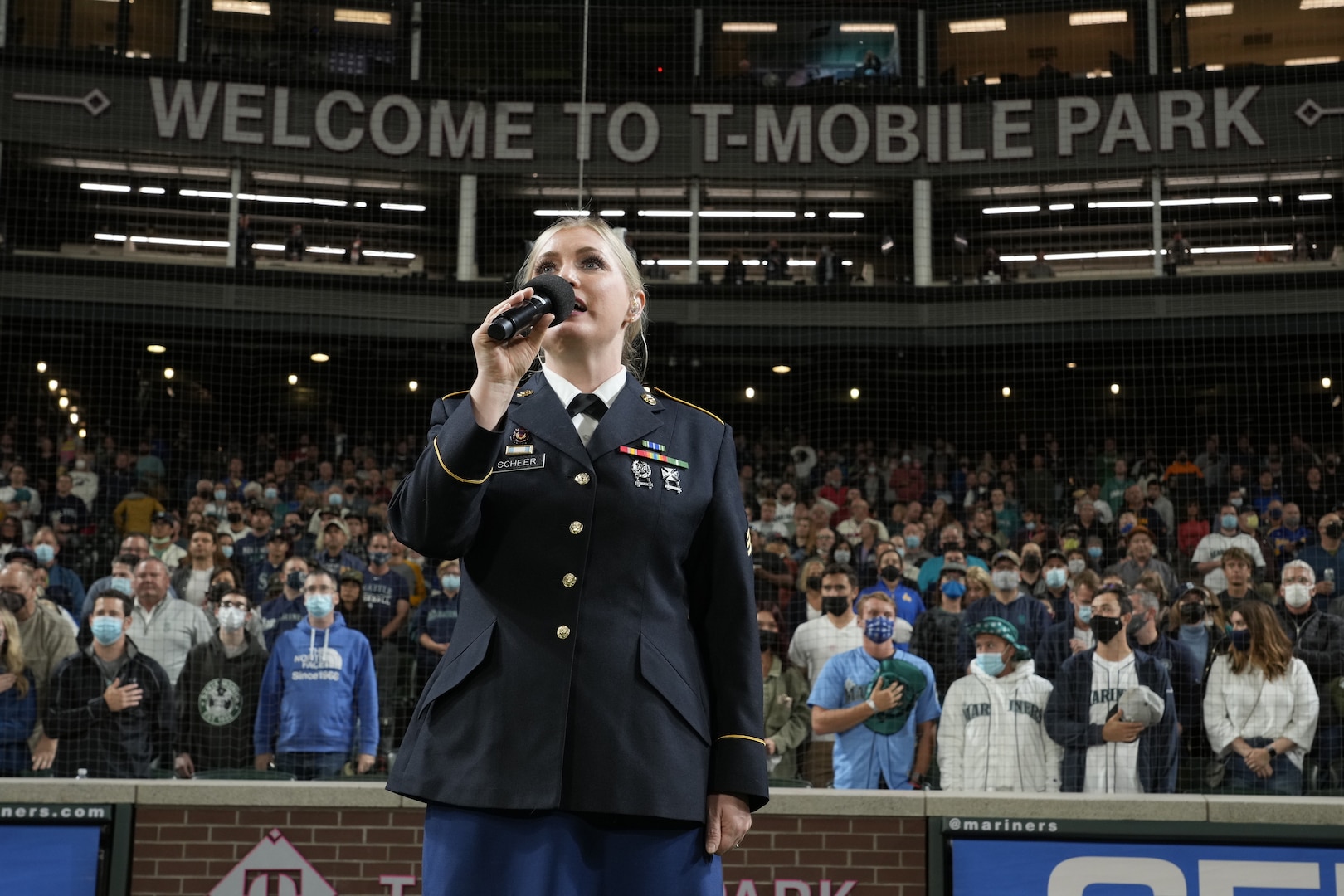 Sgt. Tricia Scheer, a vocalist with the 133rd Army National Guard Band, Washington Army National Guard, sings the national anthem before the Seattle Mariners play the Arizona Diamondbacks at T-Mobile Park, Seattle, Wash., Sept. 10, 2021.