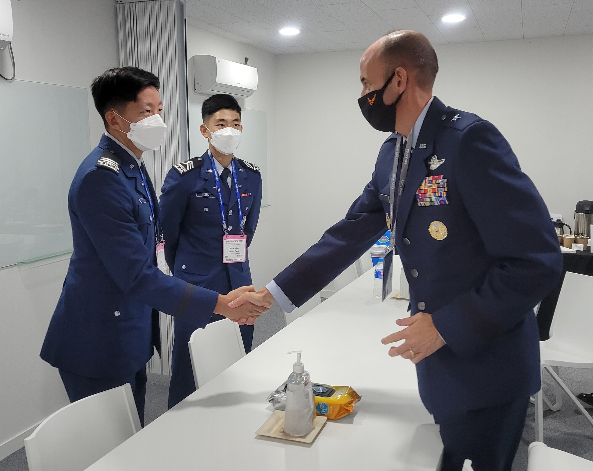 Cadet 1st Class David Song and Cadet 2nd Class Brian Park meet with Brig. Gen. E. John Teichert.