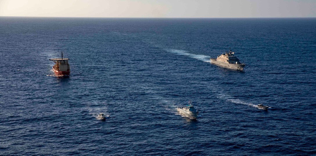 The Freedom-variant littoral combat ship USS Billings (LCS 15), participates in a photo exercise with the Dominican Republic navy coastal patrol vessel Canopus (CG 107),  the special mission support U.S. Motor Vessel Kellie Chouest, Oct. 24, 2021.