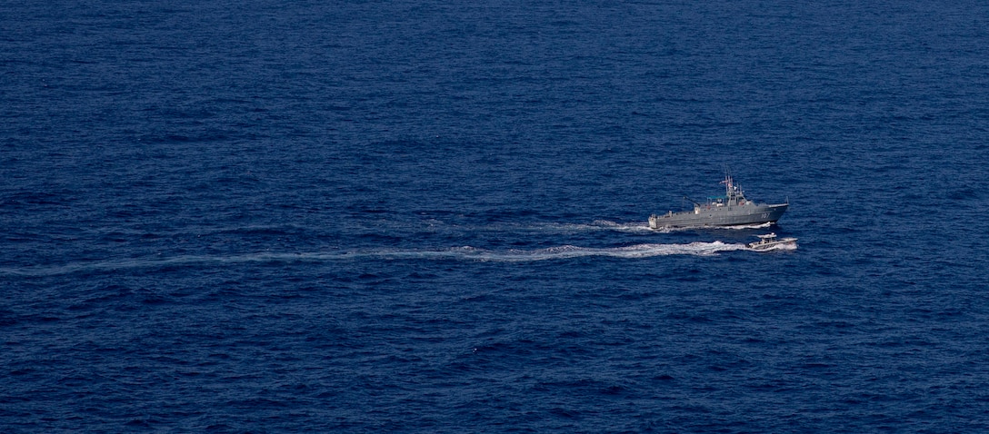 Dominican Republic Navy coast patrol vessel Canopus (CG 107), along a Dominican Republic small boat arrive for a maritime operations exercise with the USS Billings (LCS 15), Oct. 24, 2021.