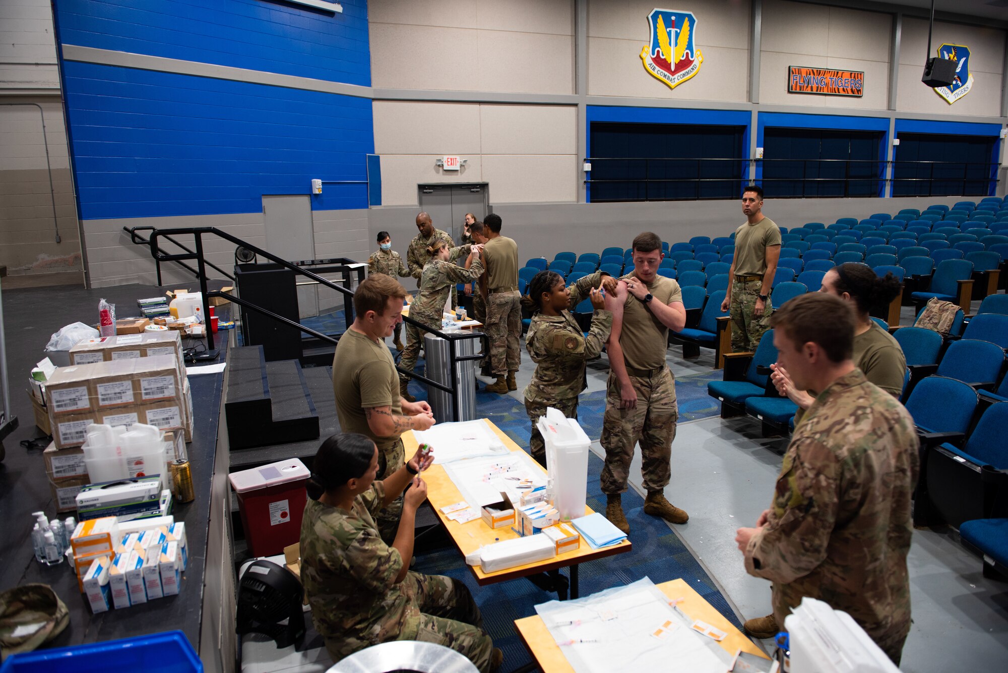 Airmen wait in line for a flu shot