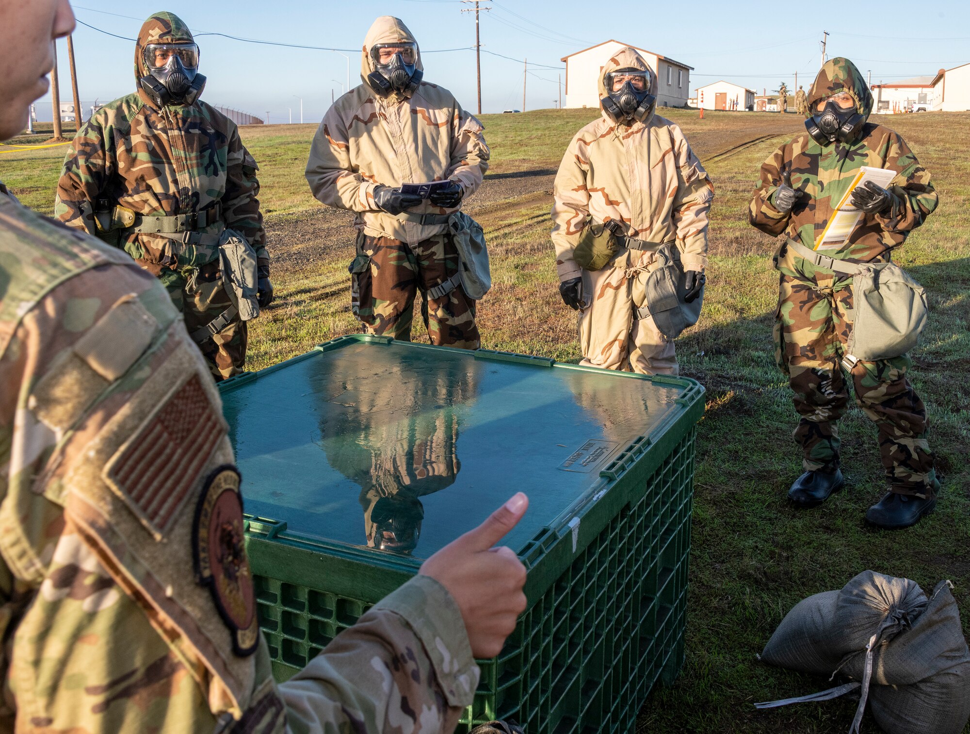 U. S. Air Force Airmen learn how to protect an “asset” during a chemical, biological, radiological and nuclear defense survival skills training course on Oct. 28 2021, at Travis Air Force Base, California. CBRN defenses are protective measures taken in situations in which chemical, biological, radiological or nuclear warfare hazards may be present. CBRN defense consists of CBRN passive protection, contamination avoidance and CBRN mitigation. (U.S. Air Force photo by Heide Couch)