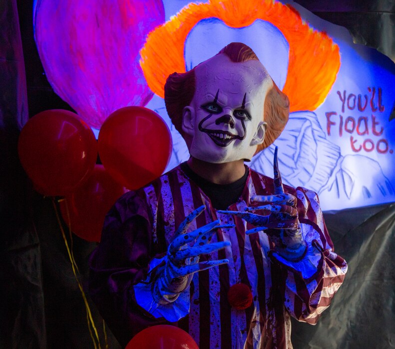 Pennywise the clown awaits visitors at the exit of the Haunted Tunnel in order to enjoy one last scare before they leave, during the 3rd annual Trunk or Treat event held aboard Marine Corps Logistics Base Barstow, California, Oct. 27.