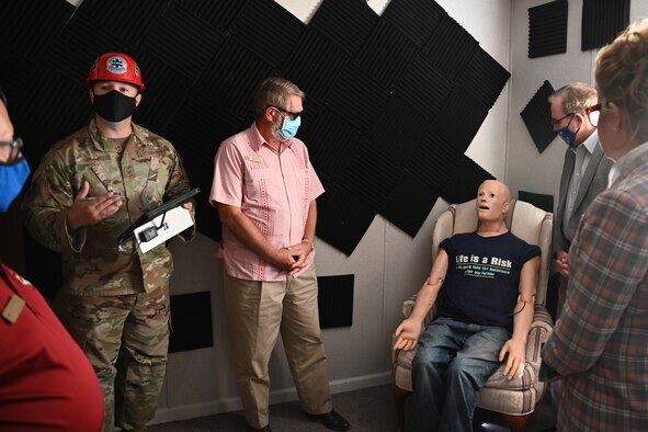 U.S. Air Force Tech. Sgt. Andrew Fruehan, 312th Training Squadron instructor, explains the training functions of the HAL manikins during an Air Education and Training Command’s Civic Leader Program tour, on Goodfellow Air Force Base, Texas, Oct. 27, 2021. The Louis F. Garland Department of Defense Fire Academy acquired the HAL manikins through community donations for use in advancement of student training. (U.S. Air Force photo by Senior Airman Ethan Sherwood)