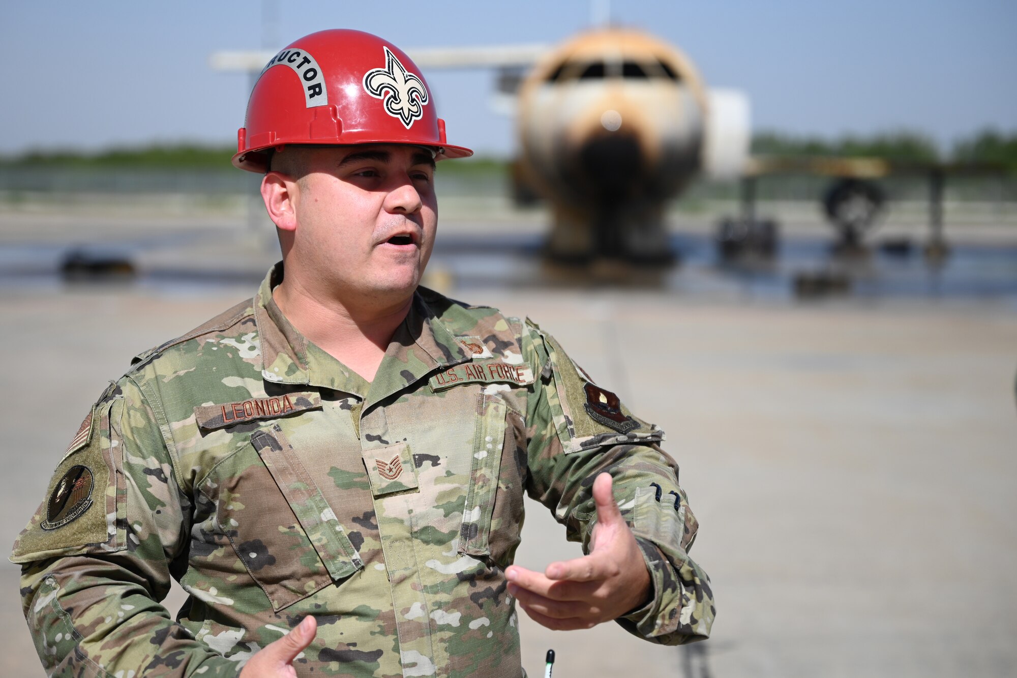 U.S. Air Force Tech. Sgt. Joshua Leonida, 312th Training Squadron fire protection instructor, briefs the Air Education and Training Command’s Civic Leader Program members during a tour, on Goodfellow Air Force Base, Texas, Oct. 27, 2021. Leonida emphasized the realistic training that the students undergo during the Airport Rescue Fire block of the basic firefighting fundamentals course. (U.S. Air Force photo by Senior Airman Ethan Sherwood)