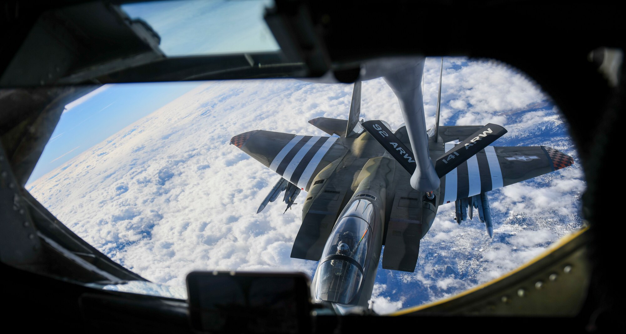 An F-15 Eagle is refueled by a KC-135 Stratotanker during an orientation flight for the Spokane Indians minor league baseball team adminstration, Oct. 27, 2021. The flight was just one part of Operation Fly Together, a joint partnership built between Fairchild and the minor league team, intended to build deeper relationships with organizations throughout the community and honor local-to-Spokane veterans of the Armed Forces. (U.S. Air Force photo by Senior Airman Kiaundra Miller)