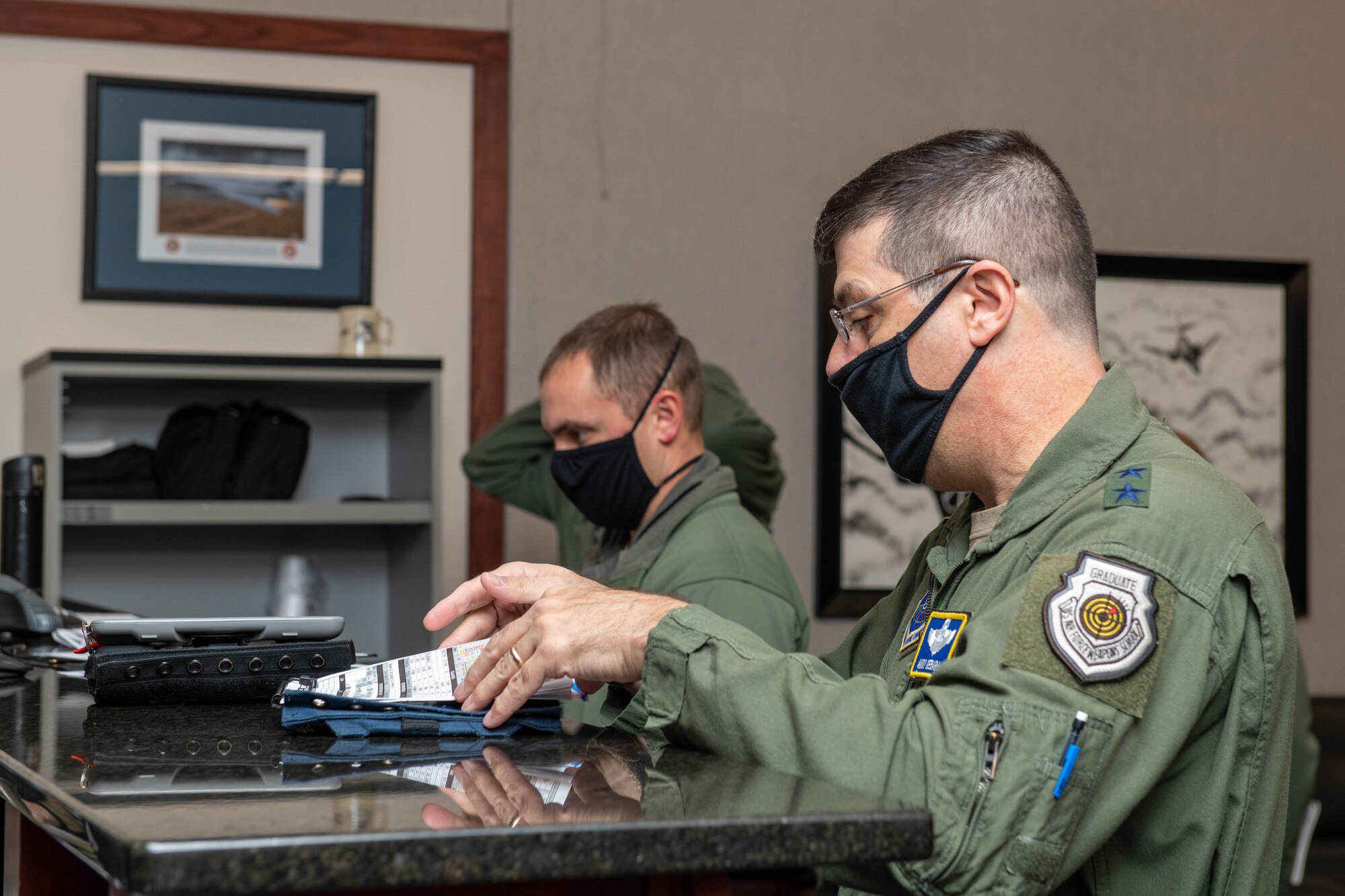 Maj. Gen. Andrew Gebara, 8th Air Force and Joint-Global Strike Operations Center commander, listens to a step briefing before flying a B-1B Lancer at Ellsworth Air Force Base, S.D., Oct. 26, 2021. Gebara received several briefings on the B-1B Lancer’s mission set and combat capabilities during his visit to Ellsworth. (U.S. Air Force photo by Airman 1st Class Quentin Marx)