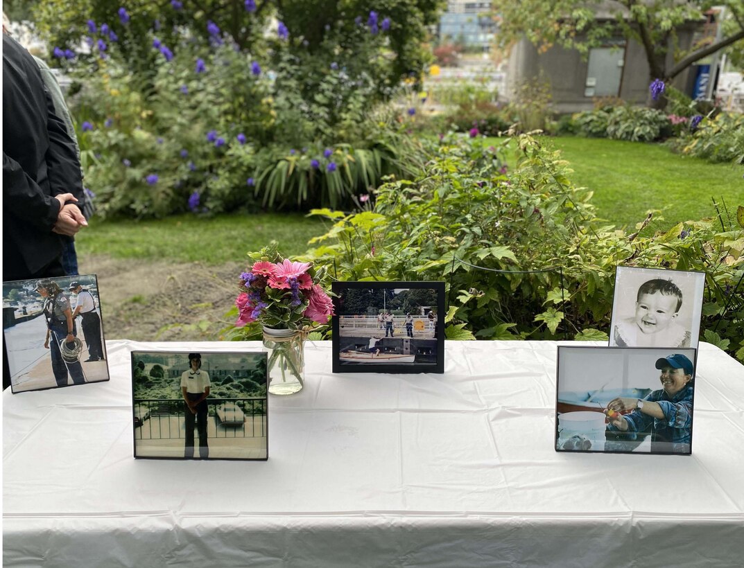 Photo of the memory table with photos of Victoria "Vickie" Shepard on display during the memorial in her honor at the Lake Washington Ship Canal and Hiram M. Chittenden Locks, Oct. 12, 2021. Shepard was the Locks' first female lockmaster.