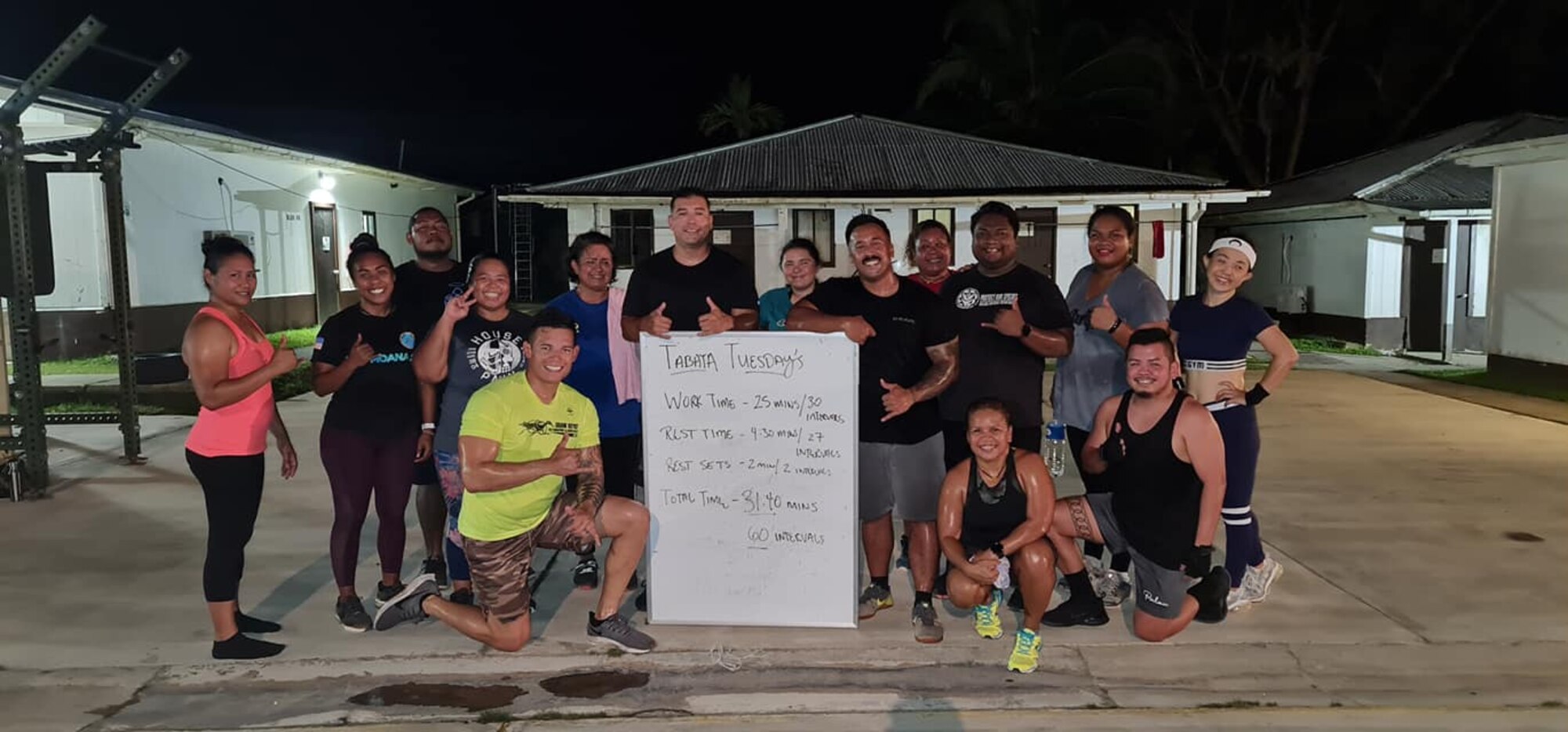 Members of the Civic Action Team Palau stand with some of the local community of Palau during a daily "house of pain" workout. The CAT is working with locals on community projects, apprenticeship training, vehicle maintenance, medical support and construction. They will be on island into the New Year.  Some community events include cultural fairs, House of pain, beach clean-ups, reading to students and more. House of pain is a daily workout the CAT does with the locals to promote unity in the community while supporting the islands "Fit Palau" initiative. (Courtesy Photo)