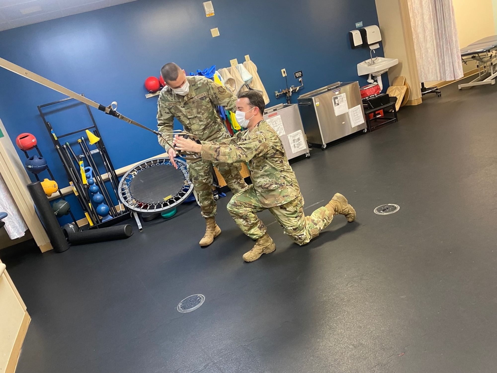 U.S. Air Force Staff Sgt. Timothy Montano, 6th Operational Medical Readiness Squadron physical therapy technician, instructs Staff Sgt. Michael Friday, 6th Operational Medical Readiness Squadron physical therapy technician, how to perform modified reverse lunges to decrease stress on his knees at MacDill Air Force Base, Florida, Oct. 26, 2021. The physical therapy clinic staff are experts in helping patients establish goals, improve biomechanics, provide individualized fitness programs, as well as provide education on various aspects of injury prevention to include healing progression and lifestyle modifications, such as sleeping positions, ergonomics and posture. (U.S. Air Force photo)