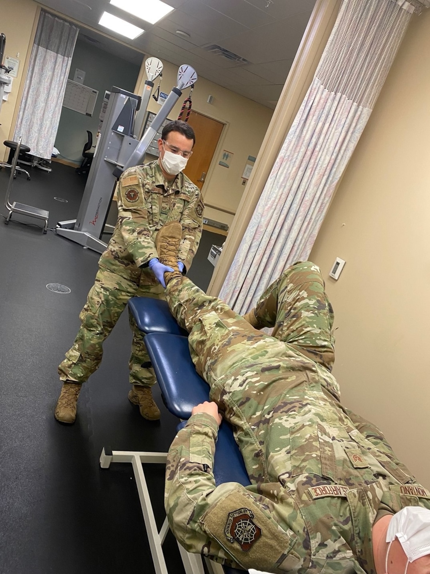 U.S. Air Force Staff Sgt. Michael Friday, 6th Operational Medical Readiness Squadron physical therapy technician, conducts manual therapy techniques to decrease hip pain at MacDill Air Force Base, Florida, Oct. 26, 2021. The physical therapy clinic staff are experts in helping patients establish goals, improve biomechanics, provide individualized fitness programs, as well as provide education on various aspects of injury prevention to include healing progression and lifestyle modifications, such as sleeping positions, ergonomics and posture. (U.S. Air Force photo)