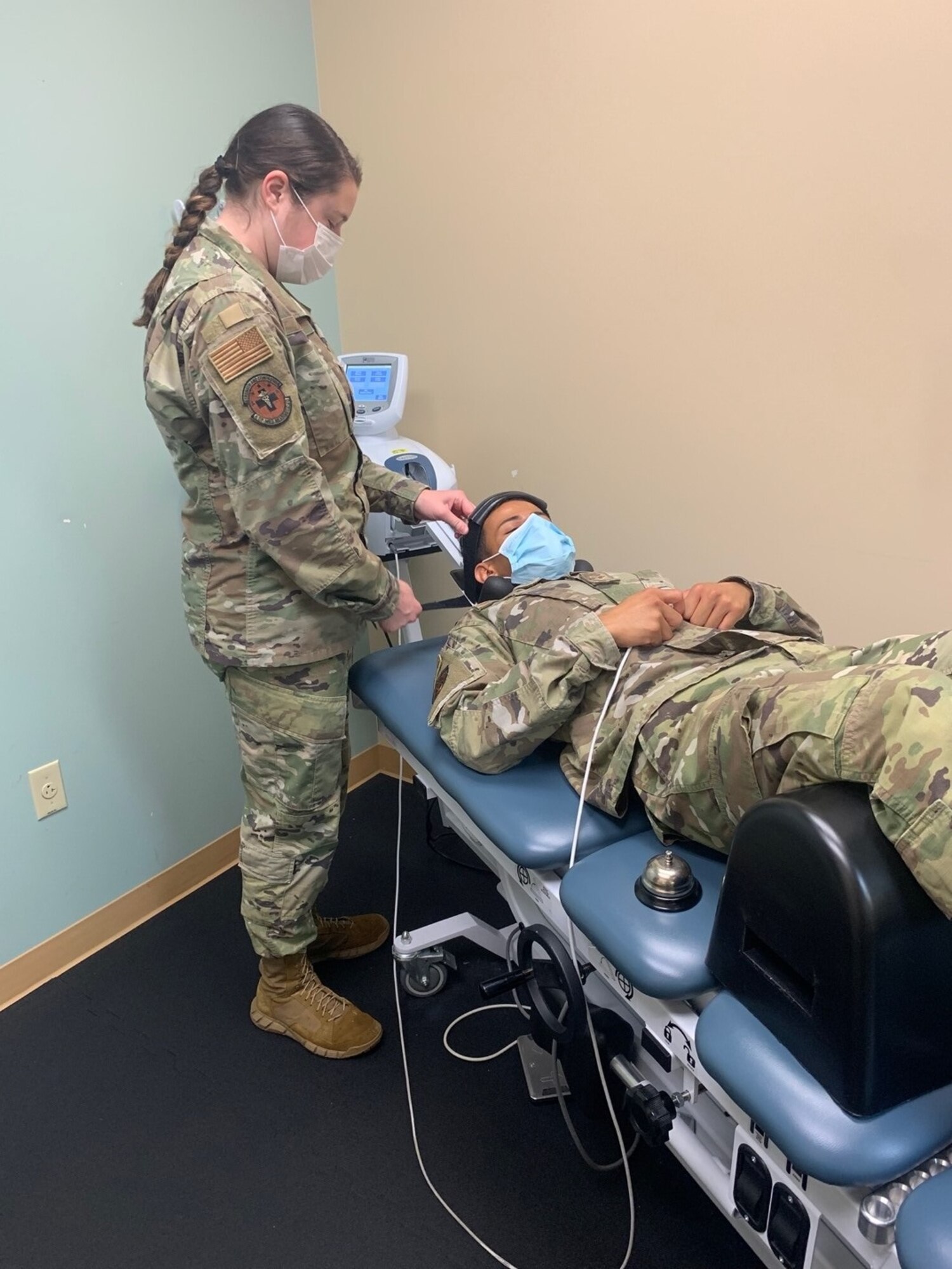 U.S. Air Force Staff Sgt. Marisa Onofrio, 6th Operational Medical Readiness Squadron physical therapy technician, conducts mechanical cervical traction on a patient to decrease neck pain at MacDill Air Force Base, Florida, Oct. 26, 2021. The physical therapy clinic staff are experts in helping patients establish goals, improve biomechanics, provide individualized fitness programs, as well as provide education on various aspects of injury prevention to include healing progression and lifestyle modifications, such as sleeping positions, ergonomics and posture. (U.S. Air Force photo)