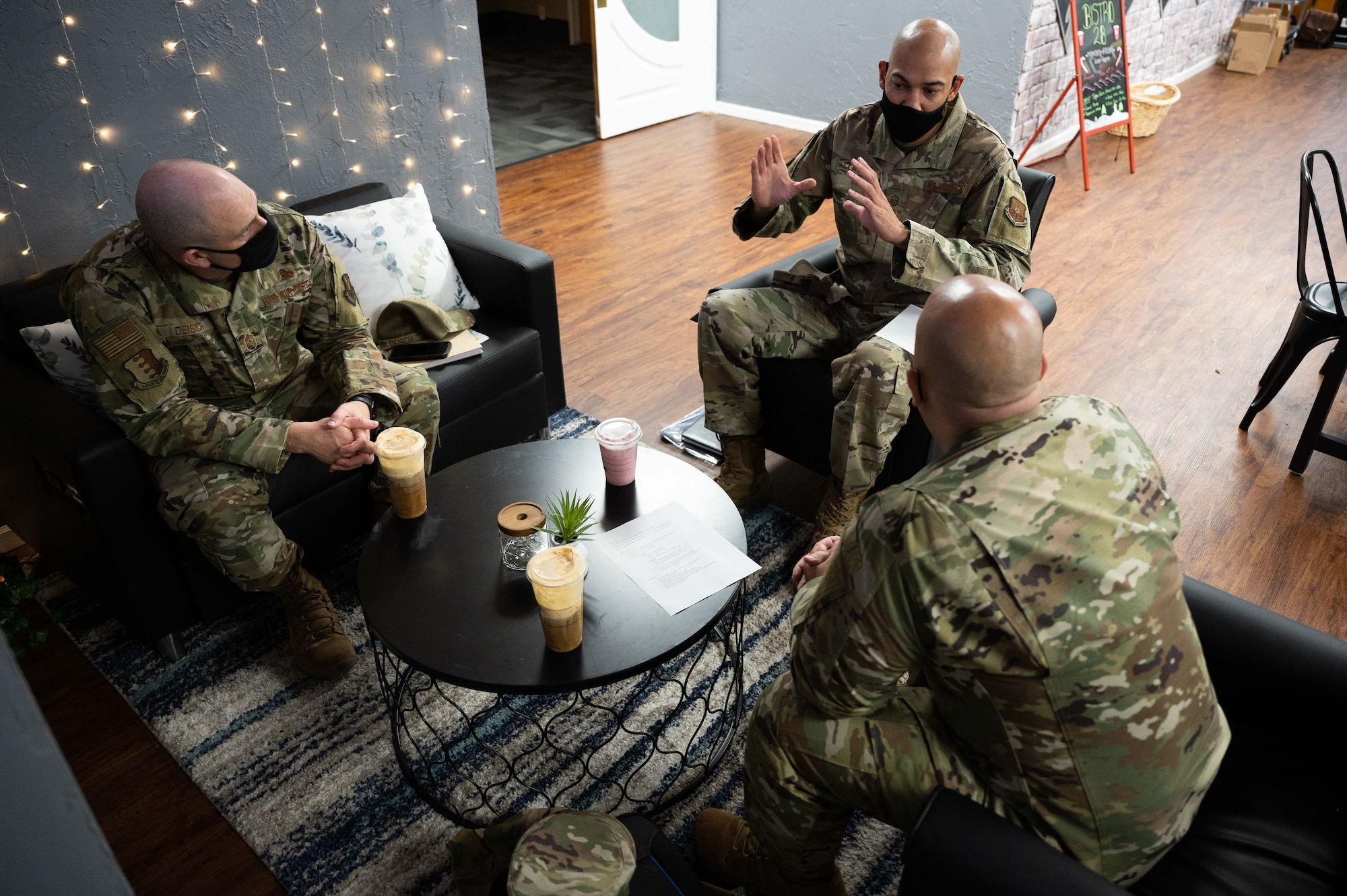 Chief Master Sgt. Steve Cenov, 8th Air Force command chief, (far right) sits with Chief Master Sgt. Justin Deisch, 28th Bomb Wing command chief, (left) and Master Sgt. Eric Clayborn, 28th Bomb Wing diversity and inclusion program manager, (middle) discussing the Diversity and Inclusion efforts at Ellsworth Air Force Base, S.D., Oct. 26, 2021. Ellsworth is the first base in Air Force Global Strike Command stand up a D&I office and begin creating positive change throughout the installation. (U.S. Air Force photo by Senior Airman Alexi Bosarge)