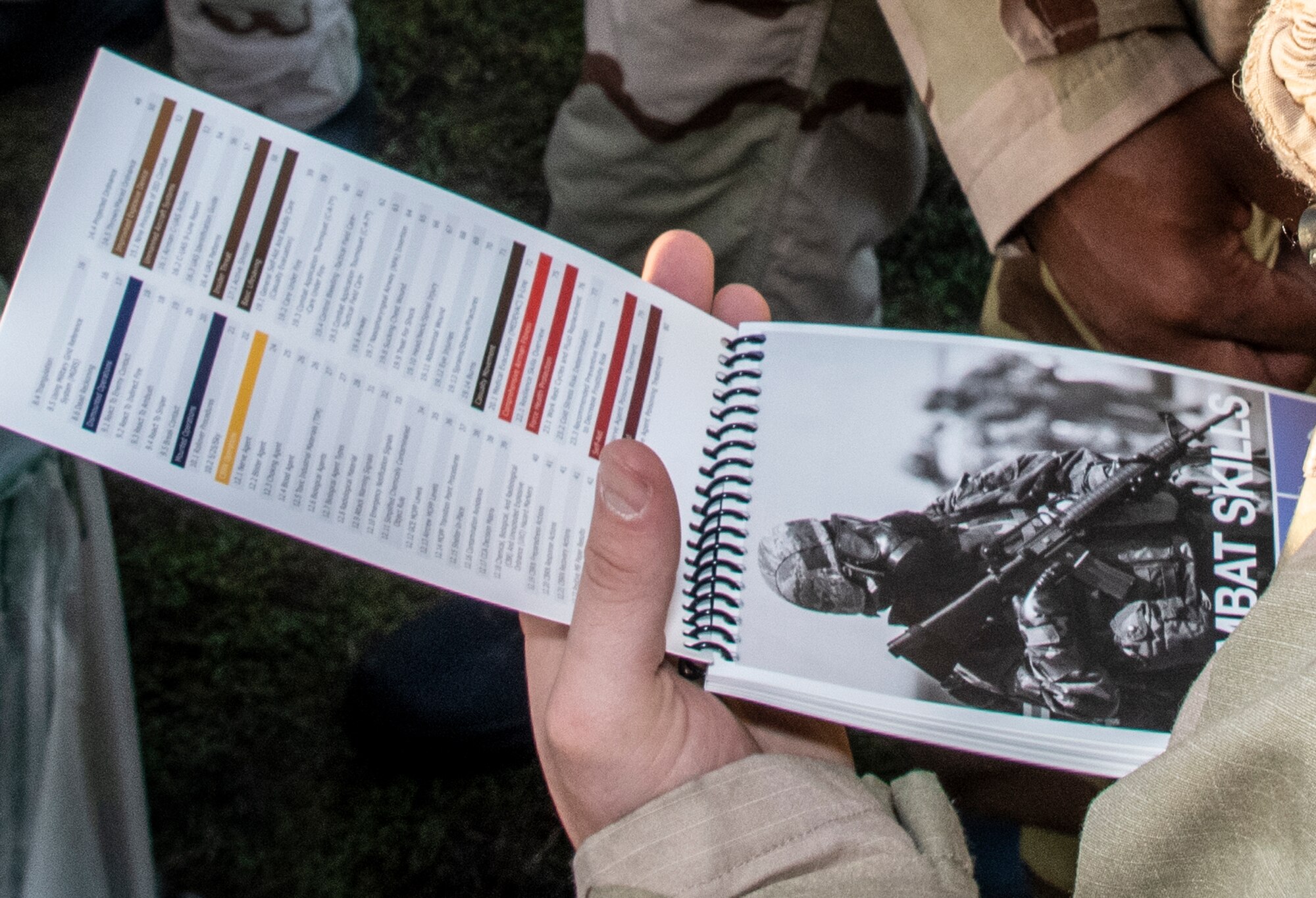 An Airman assigned to the 60th Air Mobility Wing refers to the Airmen’s Manual while participating in a base exercise on Oct. 28 2021, at Travis Air Force Base, California. Airmen test their ability to quickly and correctly don their mission oriented protective Posture equipment during a chemical, biological, radiological, nuclear training scenario. (U.S. Air Force photo by Heide Couch)