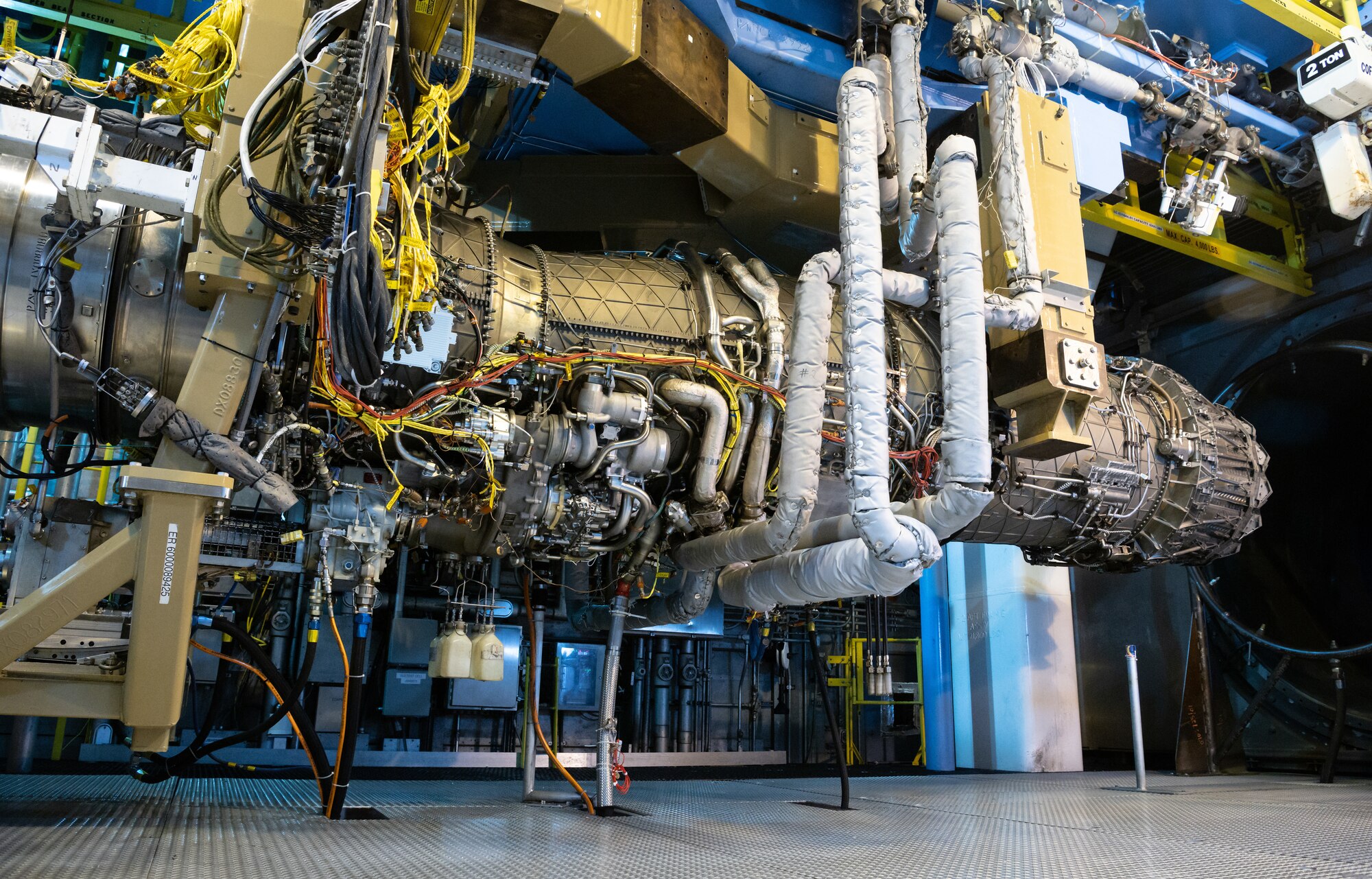 An F135 engine hangs in Arnold Engineering Development Complex (AEDC) Sea Level Test Cell 3 at Arnold Air Force Base, Tenn., between test runs Sept. 2, 2021. The F135, used to power the F-35 Joint Strike Fighter, is undergoing Accelerated Mission Testing in the AEDC facility in support of Component Improvement Program efforts. (U.S. Air Force photo by Jill Pickett)