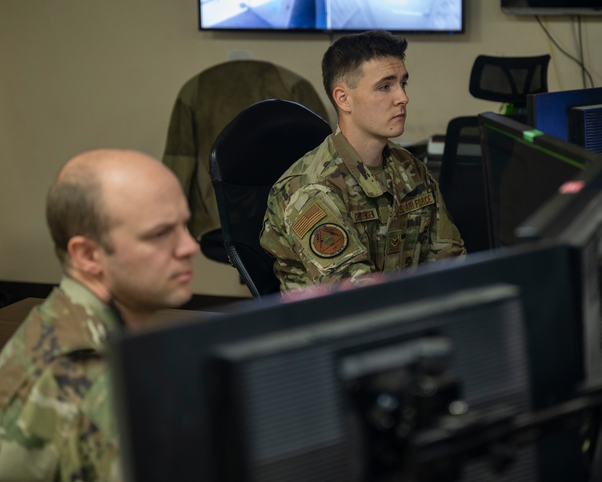 Senior Airmen Keith Christensen and Craig Davenport, 386th Air Expeditionary Wing Command Post controllers, monitors base activity at Ali Al Salem Air Base, Kuwait, Oct. 21, 2021.