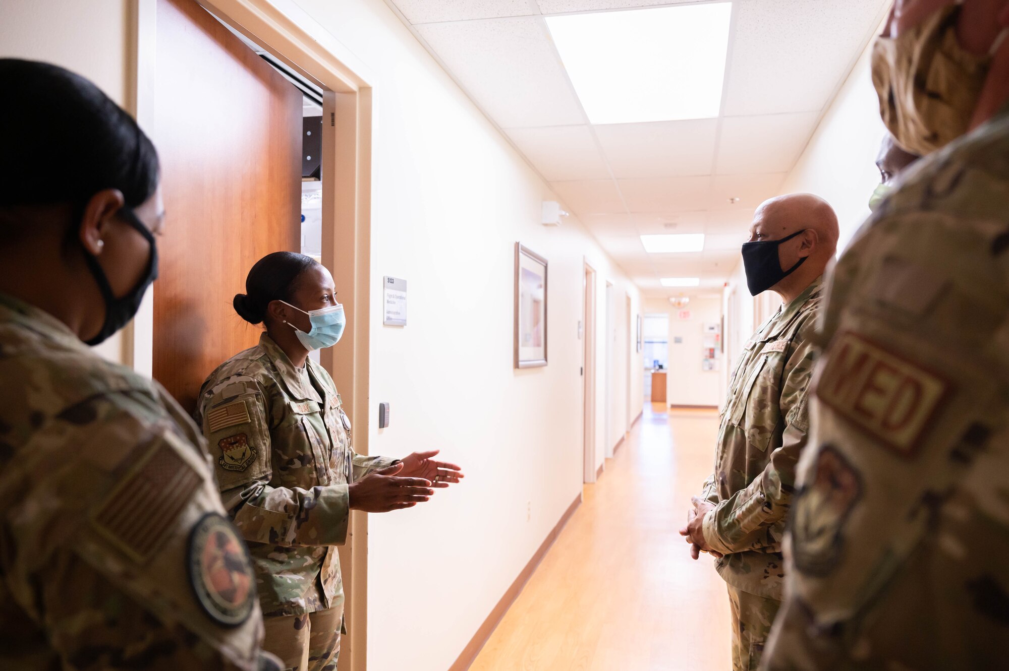Master Sgt. Ashley Fuquay, 341st Operational Medical Readiness Squadron personnel reliability assurance program flight chief, left, explains how the 341st Medical Group manages its PRAP program to Gen. Anthony Cotton, left, Air Force Global Strike Command commander Oct. 27, 2021, at Malmstrom Air Force Base, Mont.