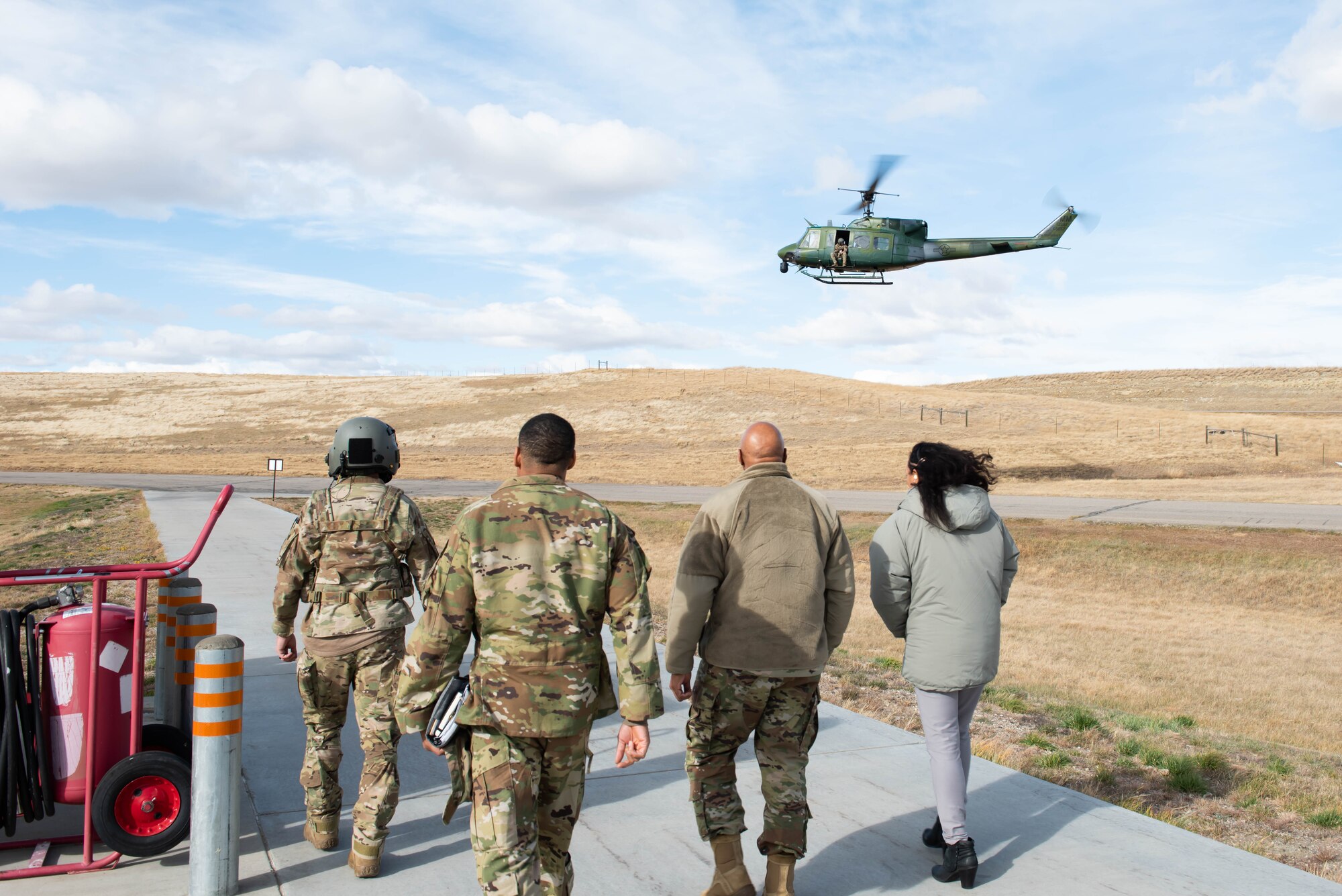Gen. Anthony Cotton, third from left, Air Force Global Strike Command commander and his wife, Marsha, far right, approach a UH-1N Huey helicopter Oct. 26, 2021, at Malmstrom Air Force Base, Mont.