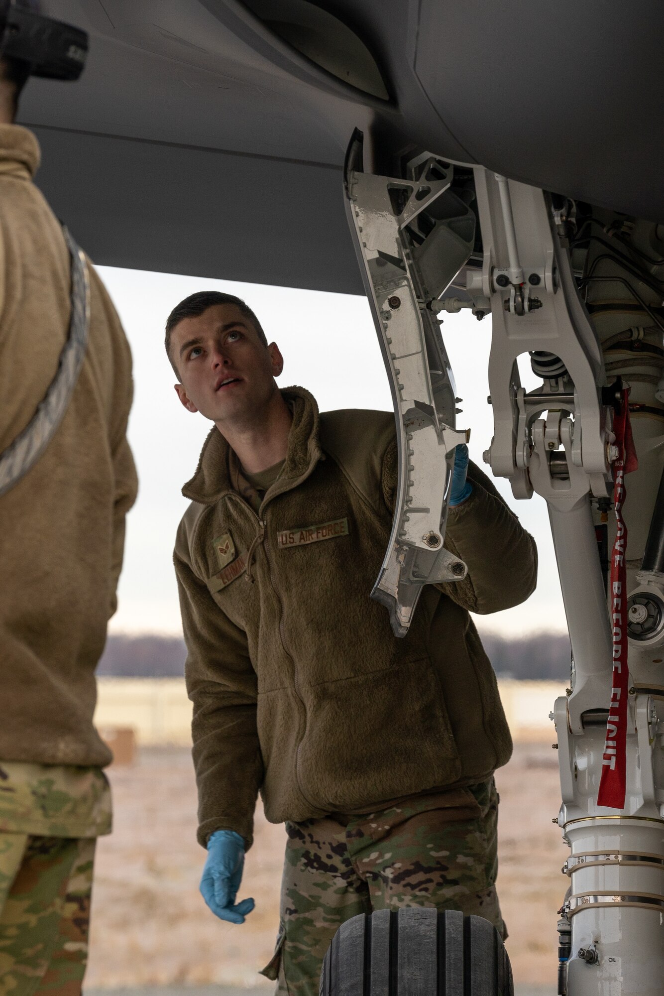 U.S. Air Force Senior Airman Adam Lehman, a 354th Aircraft Maintenance Squadron crew chief, performs a post-flight inspection on an F-35 Lightning II.