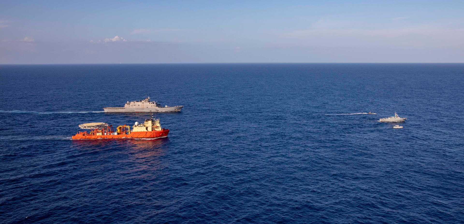 The Freedom-variant littoral combat ship USS Billings (LCS 15), participate in  a photo exercise with the Dominican Republic navy coast patrol vessel Canopus (CG 107), and the special mission ship  U.S. Motor Vessel Kellie Chouest, Oct. 24, 2021.