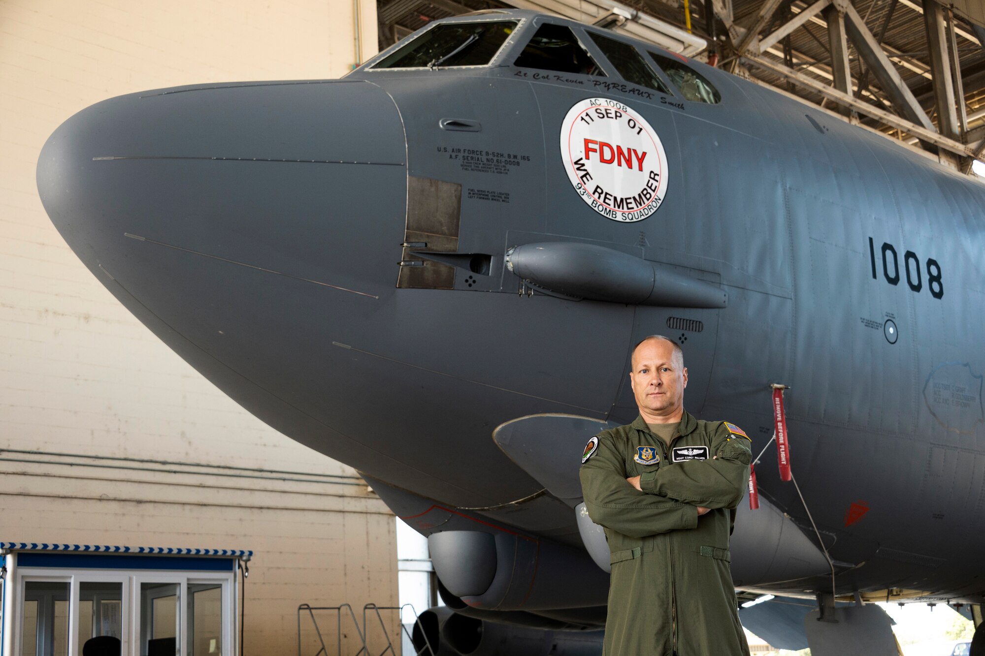 Airman stands outside a B-52