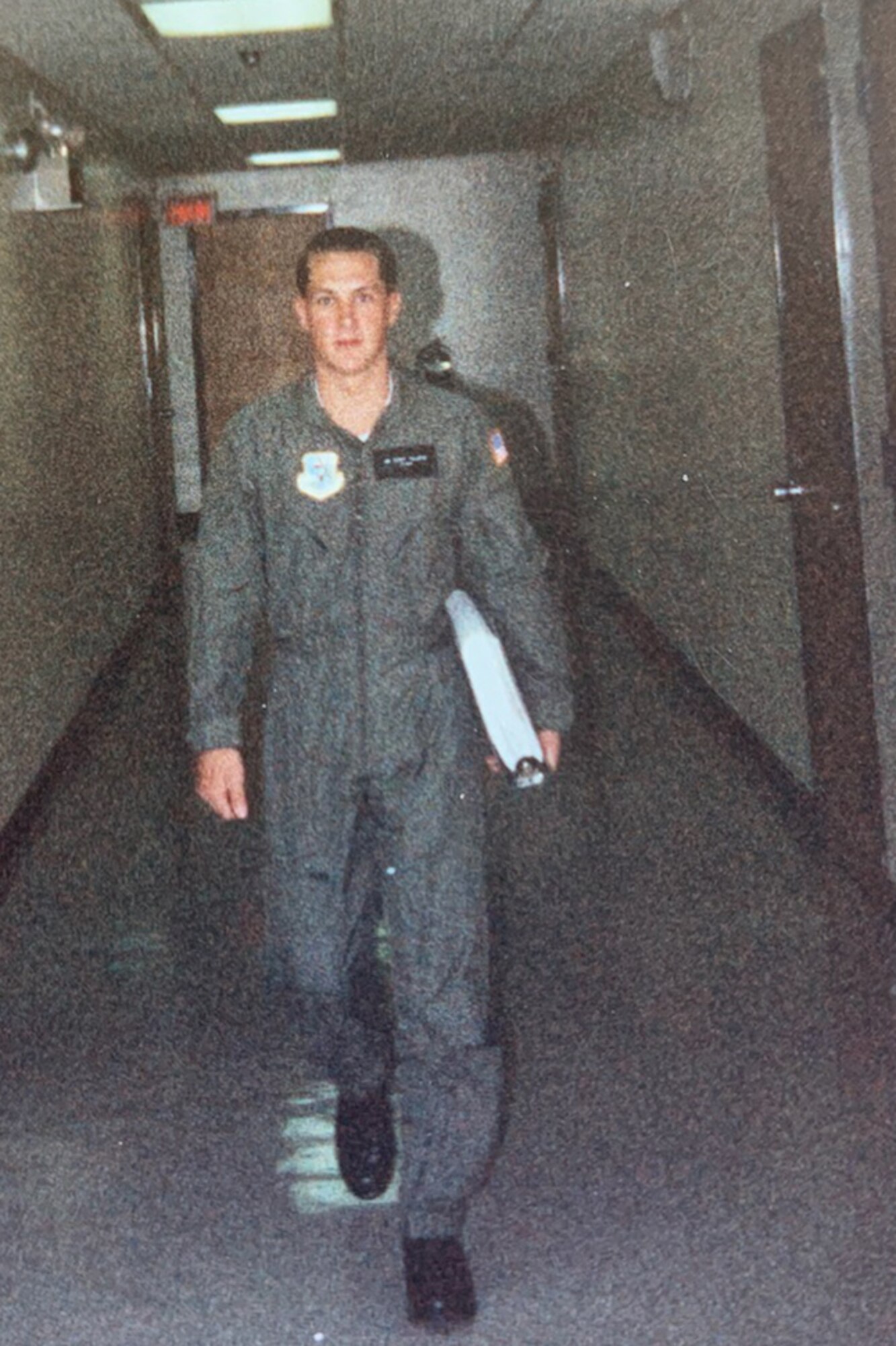 Airman walks down a hallway