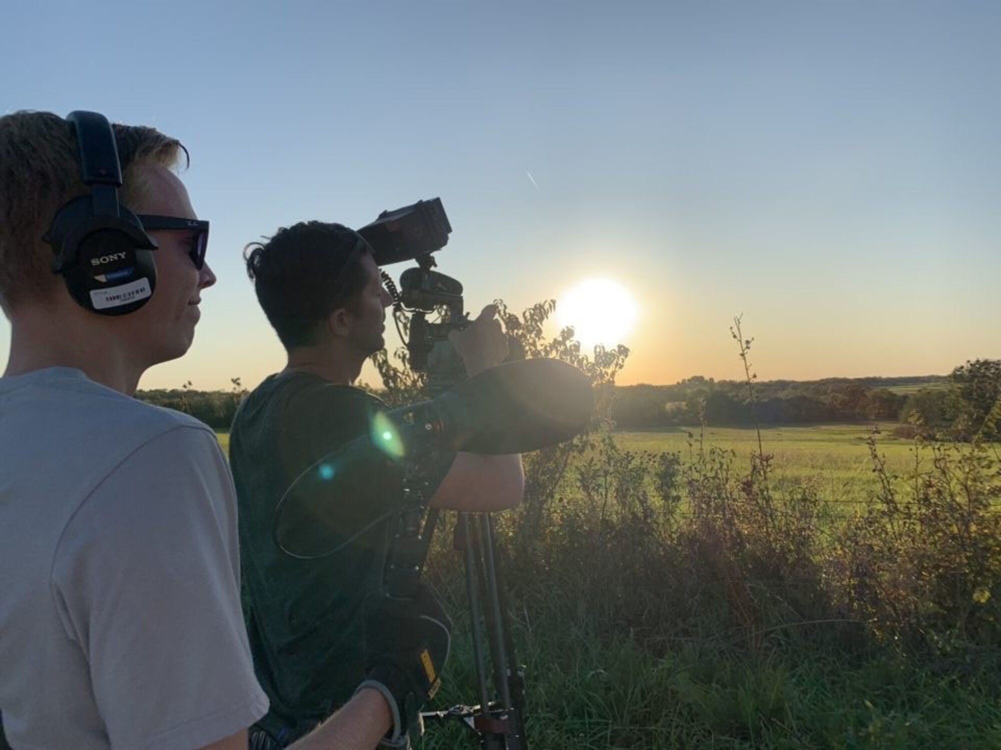 Ken Raimondi (right), a former Air Force recruiter and current civil service producer and director with the 3rd Audio Visual Squadron, captures a quiet moment on a farm in Leeton, Mo. while filming, “Basic,” an eight-part documentary series sponsored by Air Force Recruiting Service that follows five individuals as they transition from civilian to Airman.
