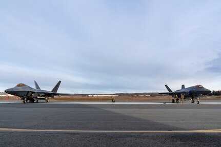 An F-22 Raptor stands next to an F-35A Lightning II.