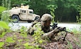 A Soldier from 1st Battalion, 109th Infantry Regiment, 2nd Infantry Brigade Combat Team, provides dismounted security while the High Mobility Multipurpose Wheeled Vehicle gunner provides rear security on the road during improvised explosive device training lane at Fort Indiantown Gap, Pa., on Aug. 11, 2021.