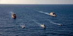 The Freedom-variant littoral combat ship USS Billings (LCS 15), participates in a photo exercise with the Dominican Republic navy coastal patrol vessel Canopus (CG 107),  the special mission support U.S. Motor Vessel Kellie Chouest, Oct. 24, 2021.