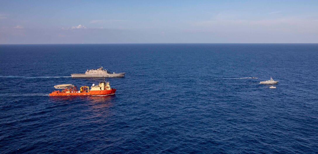 The Freedom-variant littoral combat ship USS Billings (LCS 15), participate in  a photo exercise with the Dominican Republic navy coast patrol vessel Canopus (CG 107), and the special mission ship  U.S. Motor Vessel Kellie Chouest, Oct. 24, 2021.