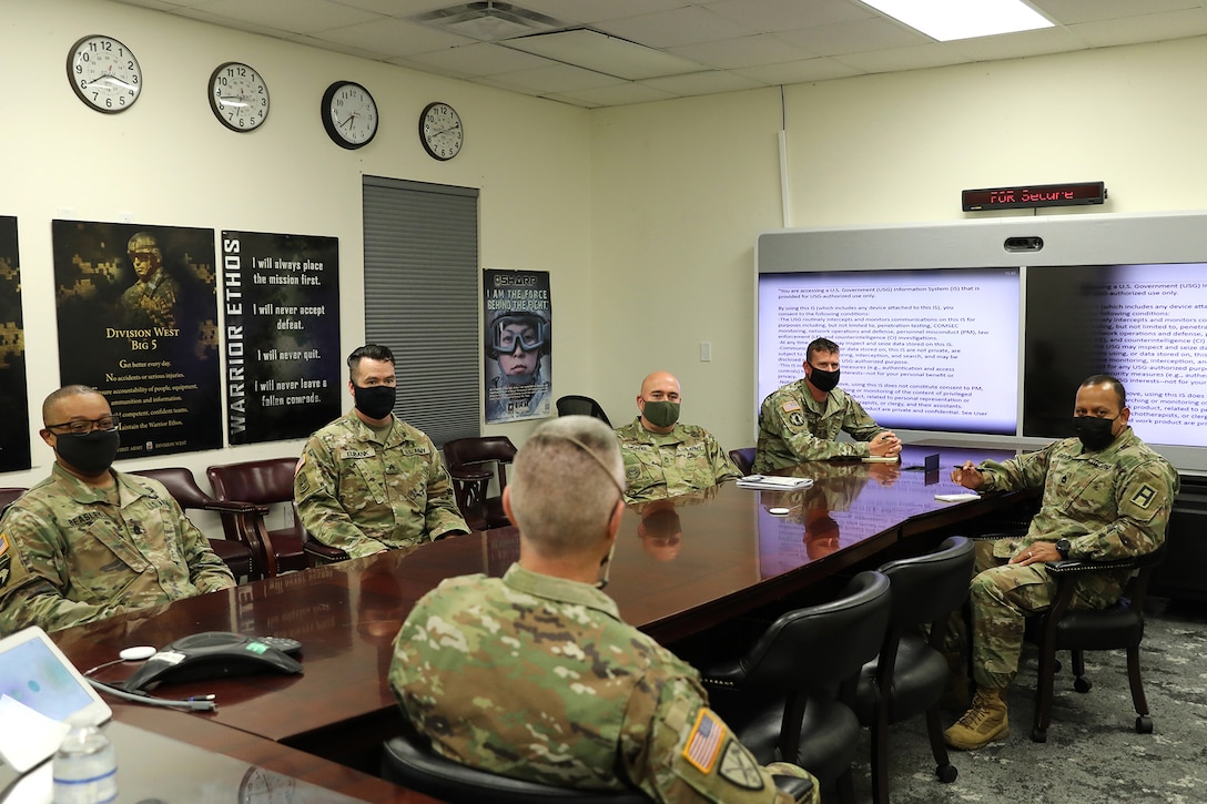 Command Sgt. Maj. Steven Slee, center, command sergeant major for the 85th U.S. Army Reserve Support Command, meets with Soldiers from the 2nd Battalion, 381st Regiment during his visit to Fort Hood, Texas, October 21, 2021.
