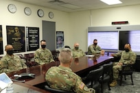 Command Sgt. Maj. Steven Slee, center, command sergeant major for the 85th U.S. Army Reserve Support Command, meets with Soldiers from the 2nd Battalion, 381st Regiment during his visit to Fort Hood, Texas, October 21, 2021.