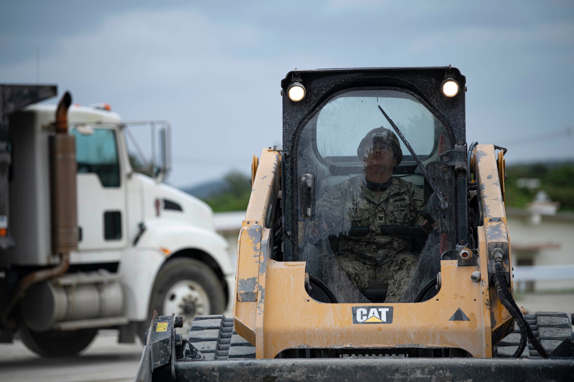 U.S. Navy member operates equipment.