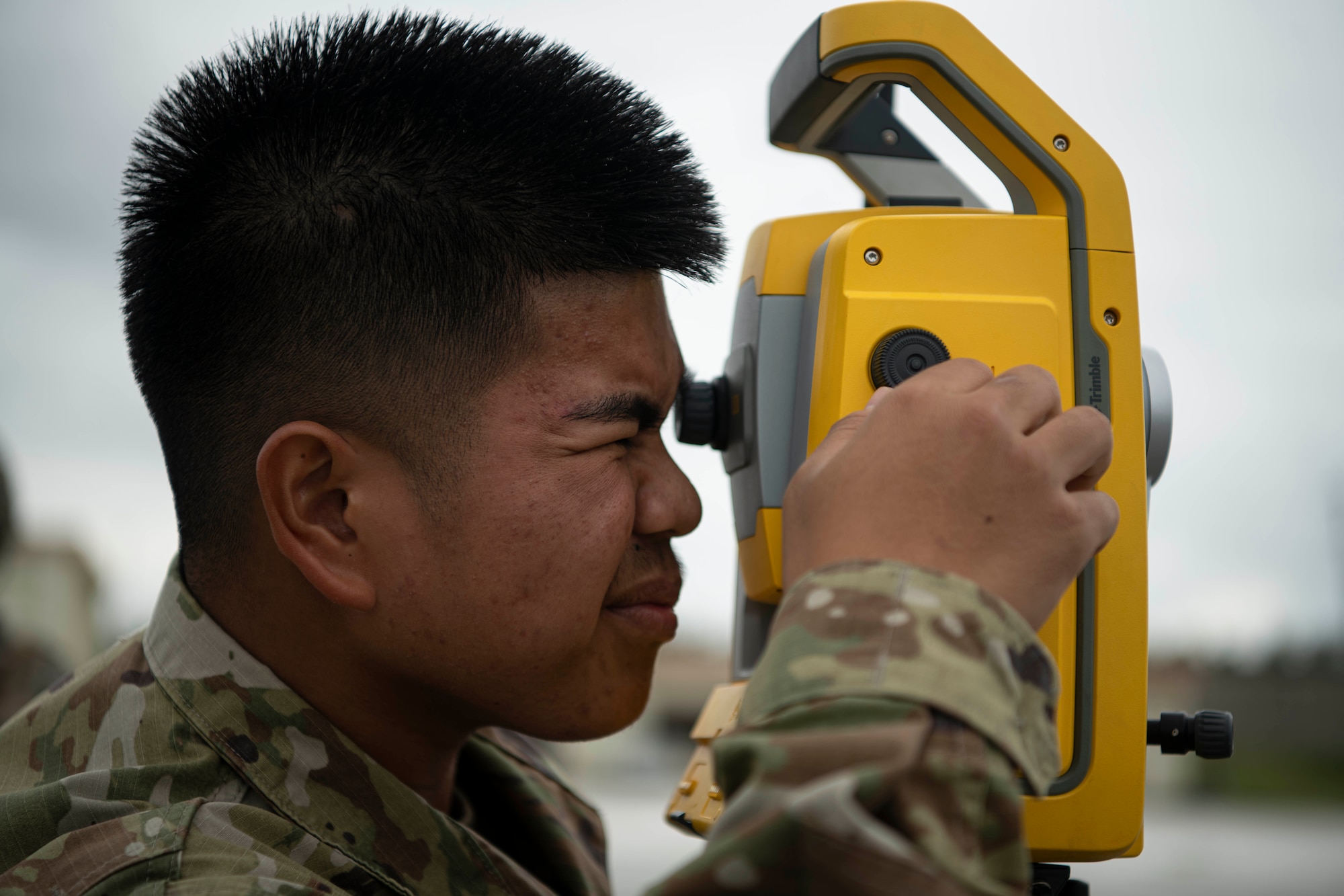 Airman looks inside equipment.