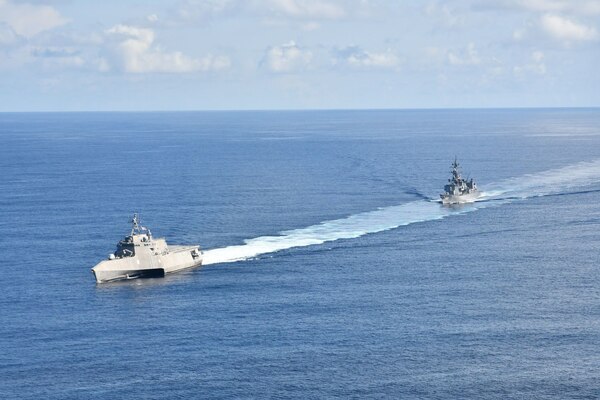 Independence-variant littoral combat ship USS Jackson (LCS 6) and Japan Maritime Self-Defense Force Murasame-class destroyer JS Yudachi (DD 103) sail together in the South China Sea. Jackson, part of Destroyer Squadron Seven, are on a rotational deployment in the U.S. 7th Fleet area of operation to enhance interoperability with partners and serve as a ready-response force in support of a free and open Indo-Pacific region.