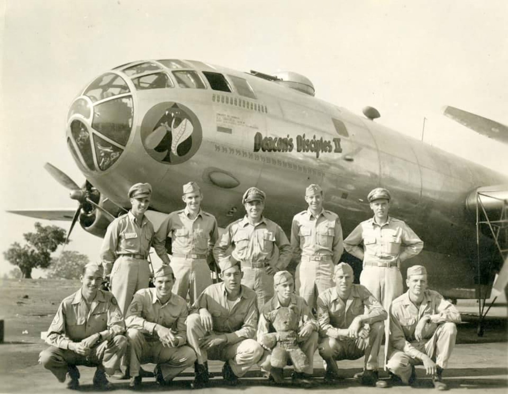 Group photo of Airmen standing in front of an aircraft.
