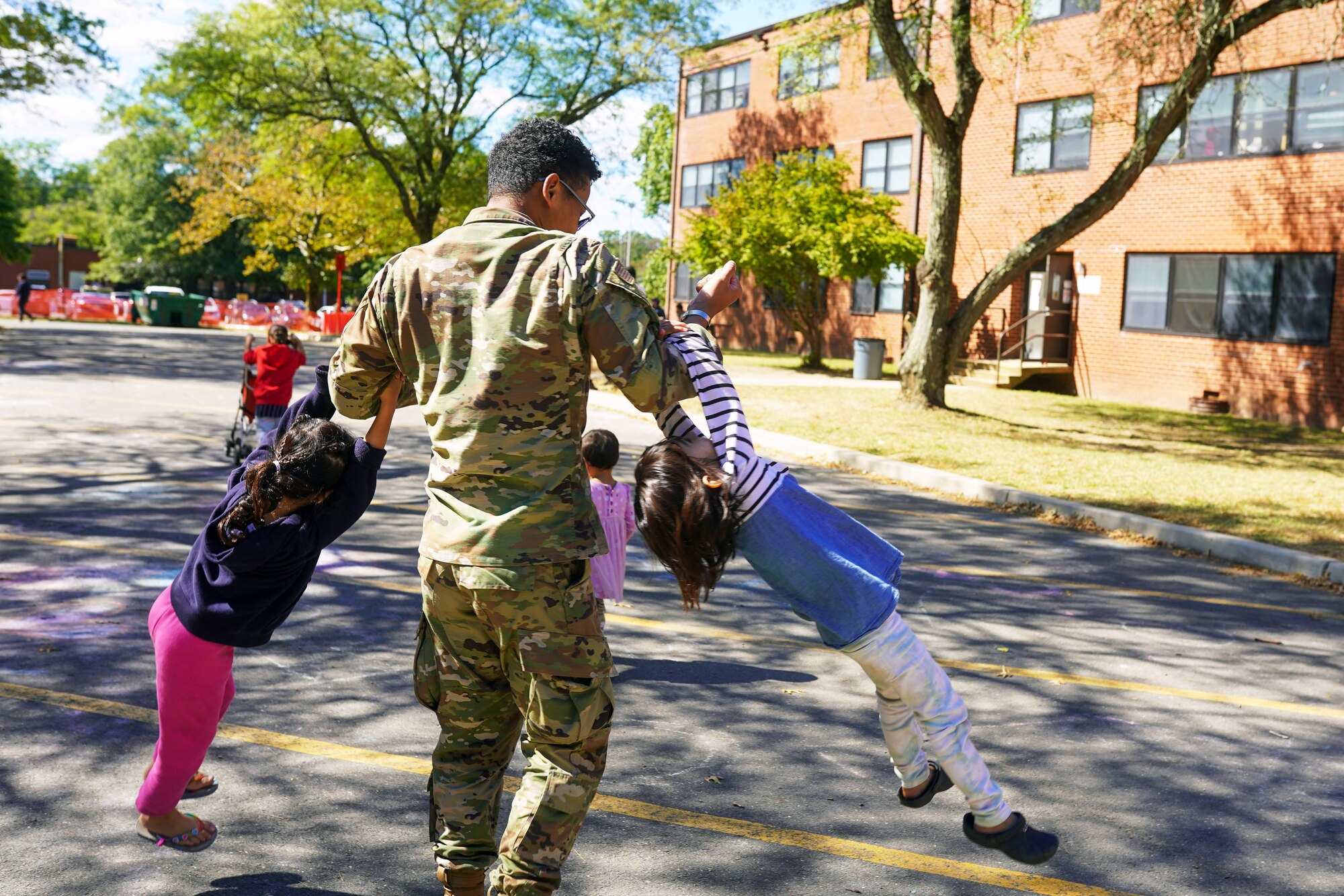 Airman plays with Afghan guests.