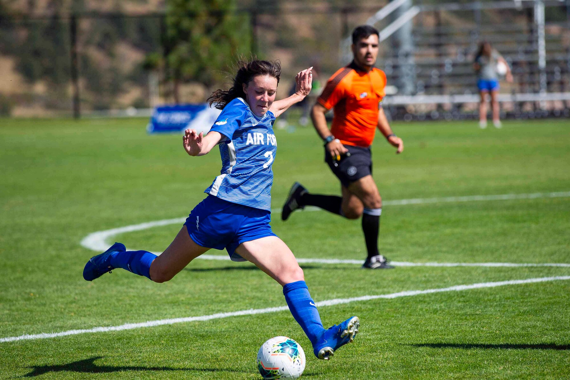 Air Force Academy cadet attempts to kick the ball.