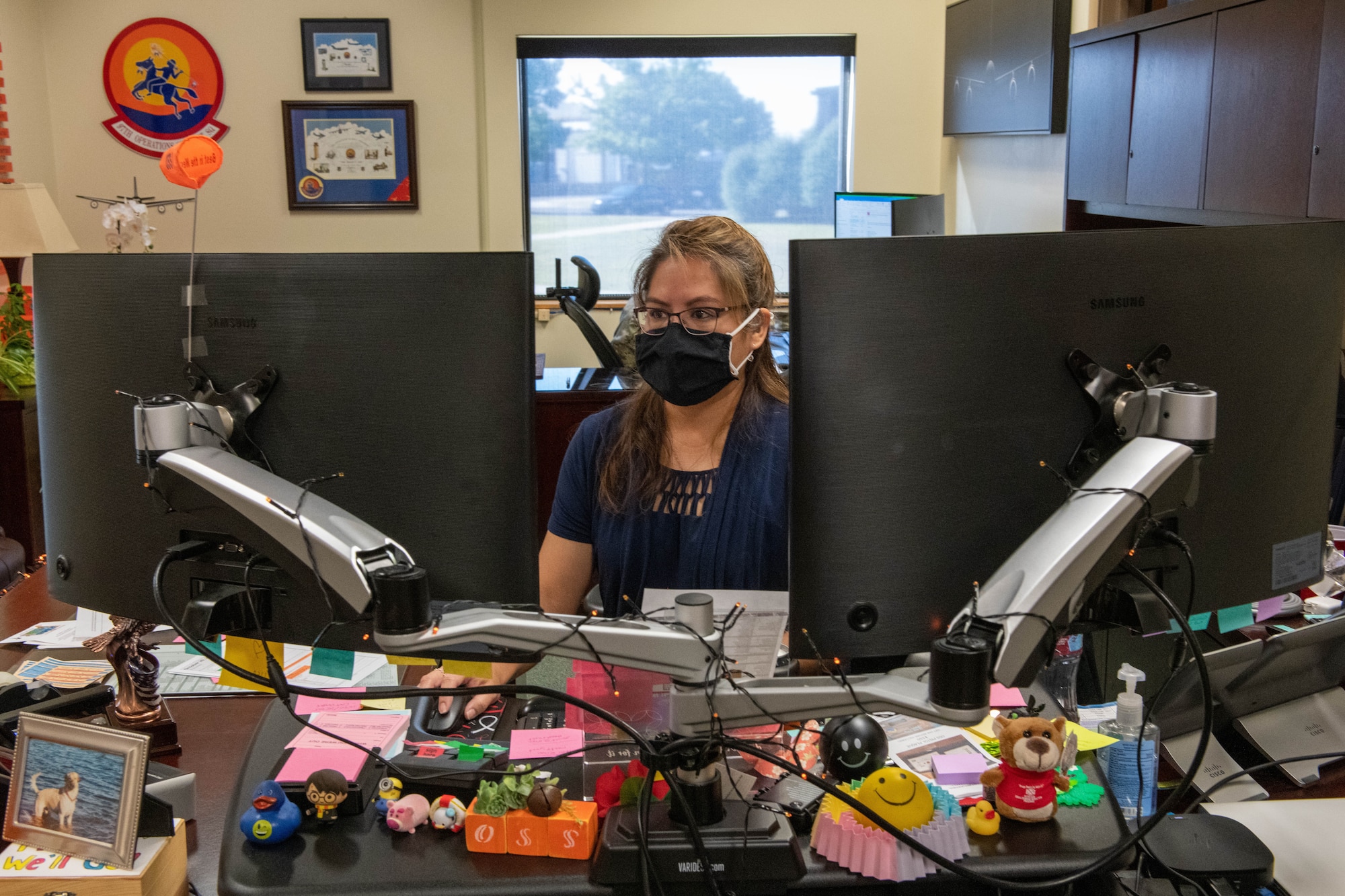 Rosemary Cook, 97th Operations Support Squadron commander’s secretary, sits at her desk on Altus Air Force Base, Oklahoma, Oct. 20, 2021. Cook serves as her commander’s trusted representative, executing over 3,000 tasks and overseeing more than 140 additional duties. (U.S. Air Force photo by Airman 1st Class Trenton Jancze)