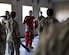 U.S. Air Force Staff Sgt. Tyler Arevalo (center), Raven, 316th Security Forces Group, teaches Airmen non-lethal combat strategies during the Malcolm Grow Medical Clinics and Surgery Center Fair at Joint Base Andrews, Md., Oct. 26, 2021.