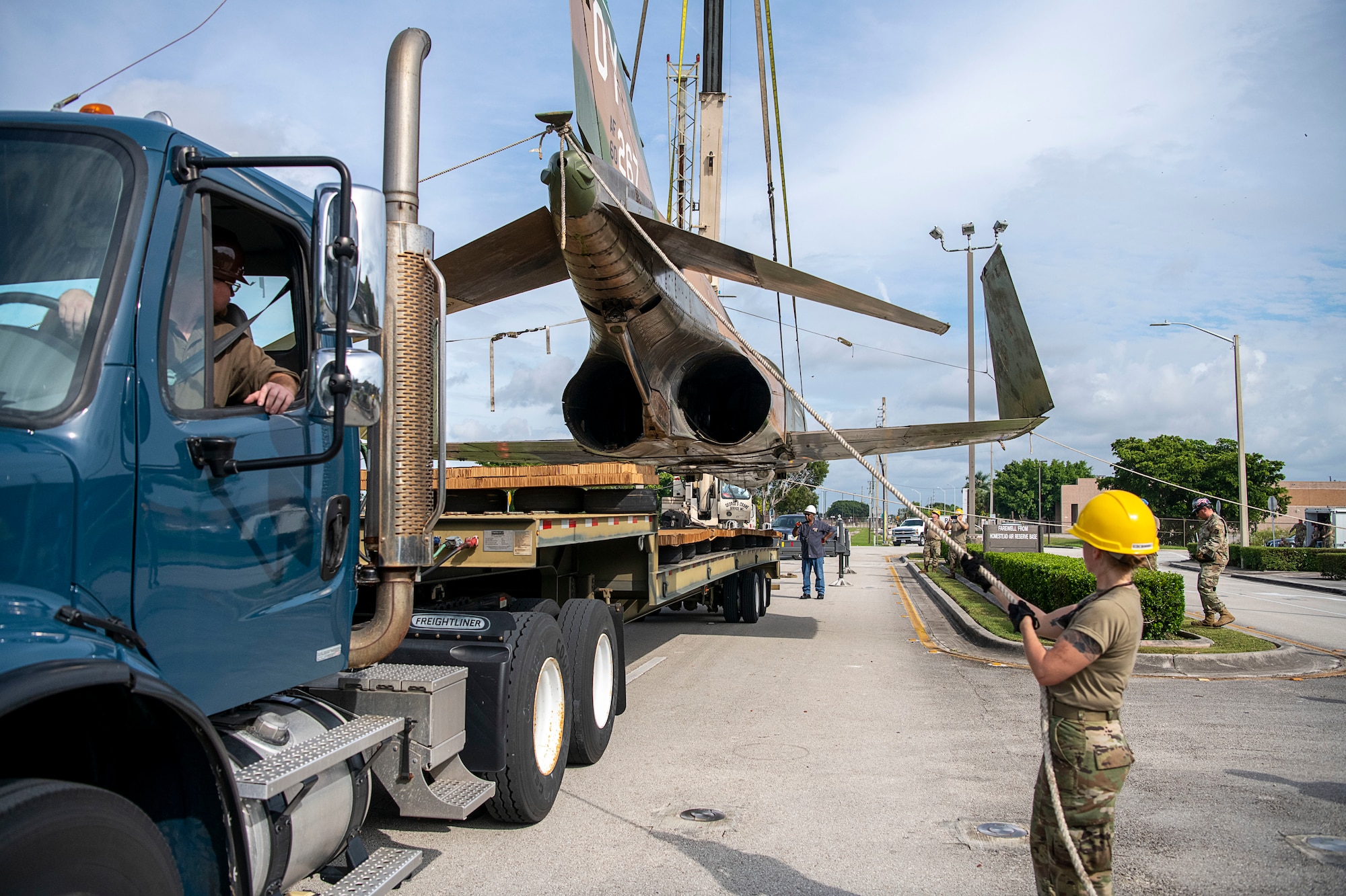 Personnel load F-4D fighter jet, serial number 66-0267, to a flatbed trailer prior to being transported to the aircraft corrosion control facility at Homestead Air Reserve Base, Fla., on Oct. 28, 2021 (U.S. Air Force photo by Tim Norton)