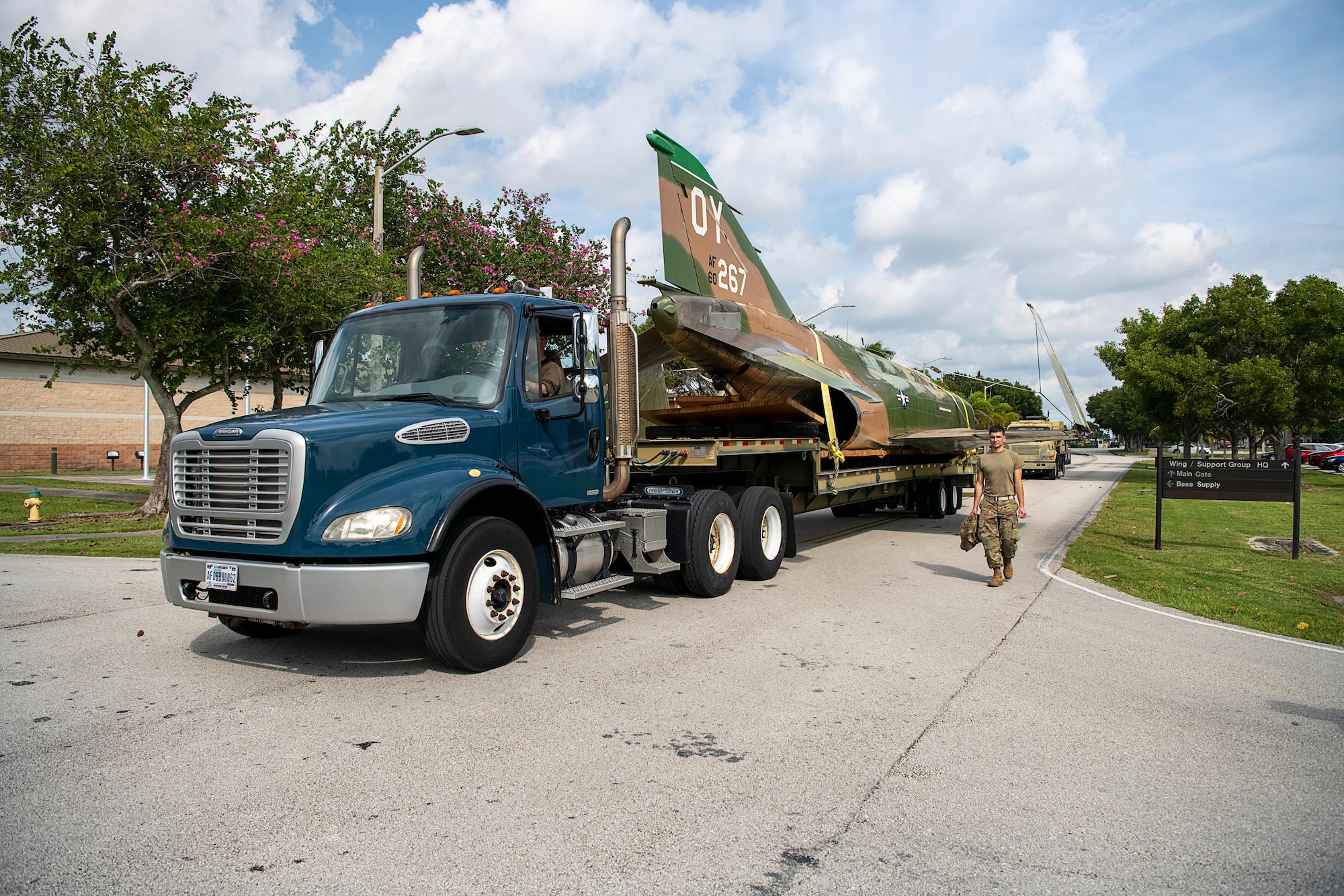 F-4D fighter jet serial number 66-0267 is transported by the 482nd Logistics Readiness Squadron and 482nd Maintenance Squadron personnel to the aircraft corrosion control facility at Homestead Air Reserve Base, Fla., on Oct. 28, 2021 (U.S. Air Force photo by Tim Norton)
