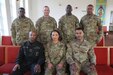 Command Sgt. Major Thipphawan Grant (bottom row, center), the sergeant major of Army Field Support Battalion Germany, poses for a group photo with fellow sergeants major and command sergeants major at the chapel on Rose Barracks in Vilseck, Germany. Grant served for more than two years as the sergeant major of AFSBn Germany. She was presented with an Army Meritorious Service Medal and laterally promoted to command sergeant major at her farewell ceremony Oct. 29.