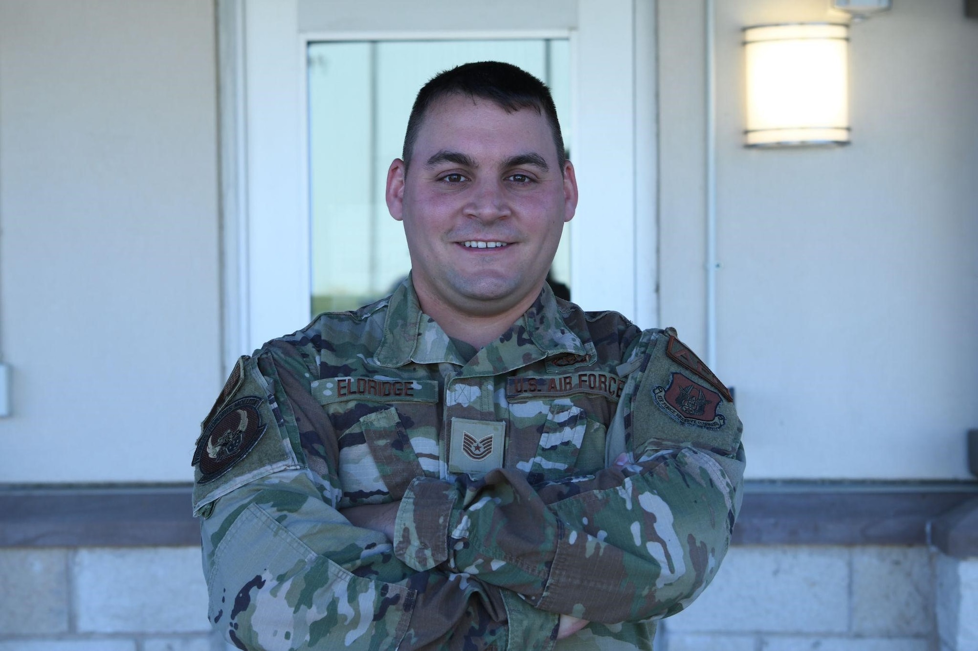 Tech. Sgt. Derrick Eldridge, 301st Fighter Wing Aircrew Flight Equipment non-commissioned officer in charge, stands ready at the door of AFE’s building at U.S. Naval Air Station Joint Reserve Base Fort Worth, Texas on September 29, 2021. AFE Airmen are responsible for ensuring that all flight and safety equipment such as flight helmets, parachutes, oxygen masks and other survival items are in working order. (U.S. Air Force photo by Staff Sgt. Nije Hightower)