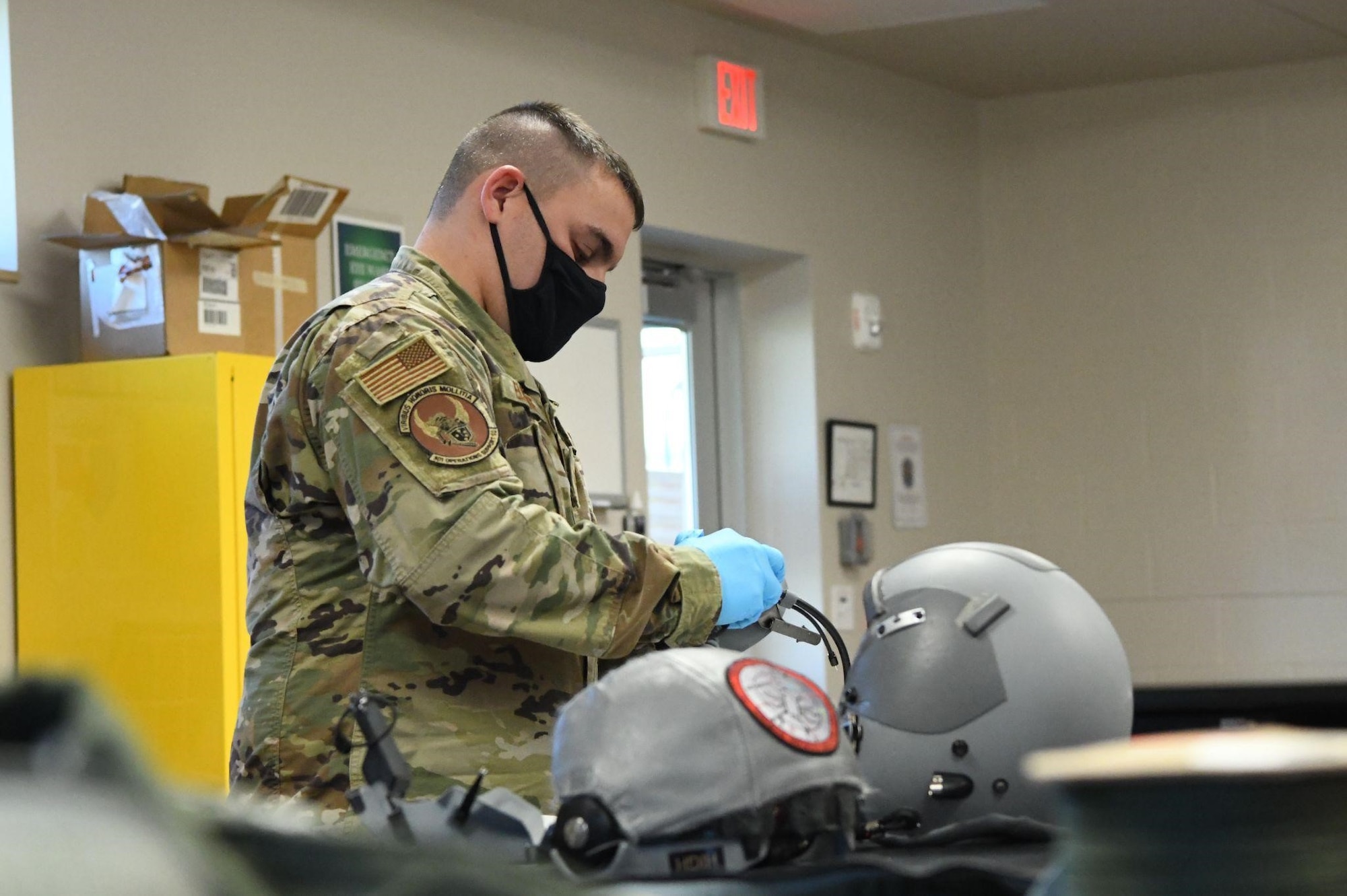 Tech. Sgt. Derrick Eldridge, 301st Fighter Wing Aircrew Flight Equipment non-commissioned officer in charge, assembles an F-16 oxygen mask at U.S. Naval Air Station Joint Reserve Base Fort Worth, Texas on September 29, 2021. AFE performs routine flight equipment inspections to ensure proper function. (U.S. photo Air Force by Staff Sgt. Nije Hightower)